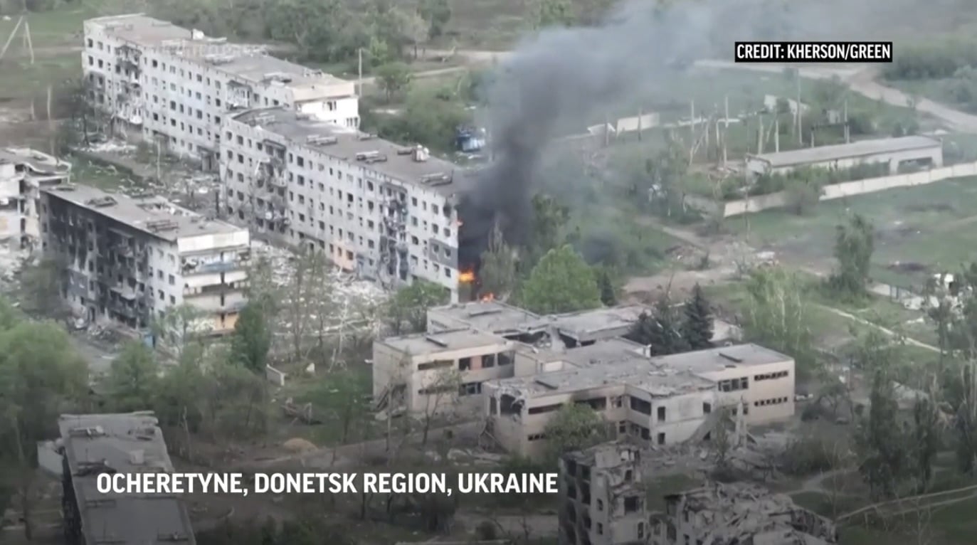 Aerial view of shelled apartment blocks burning in Ocheretyne, Donetsk region, Ukraine.