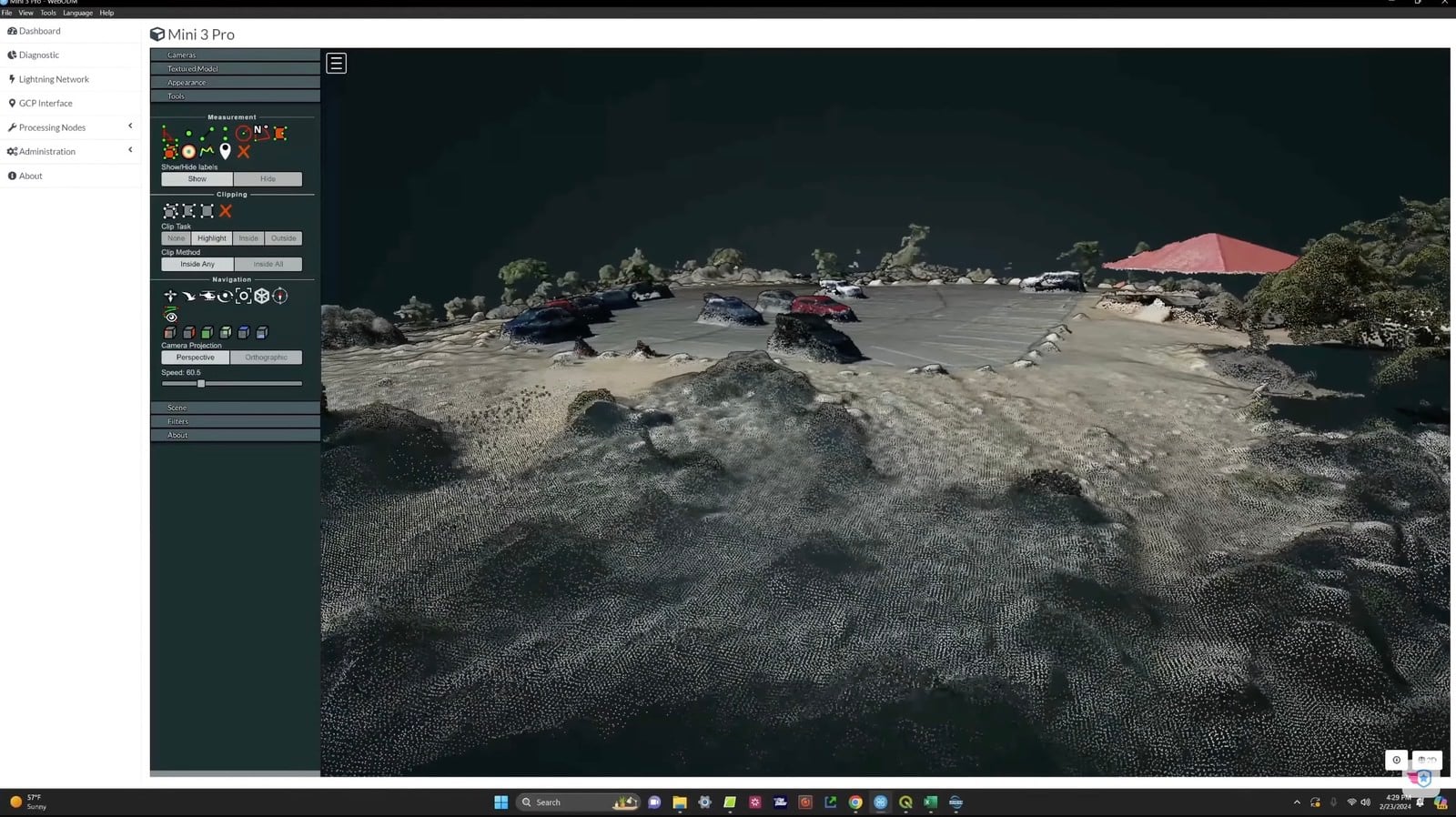 Screenshot of the WebODM 3D model rendering rocky terrain beside the parking lot.
