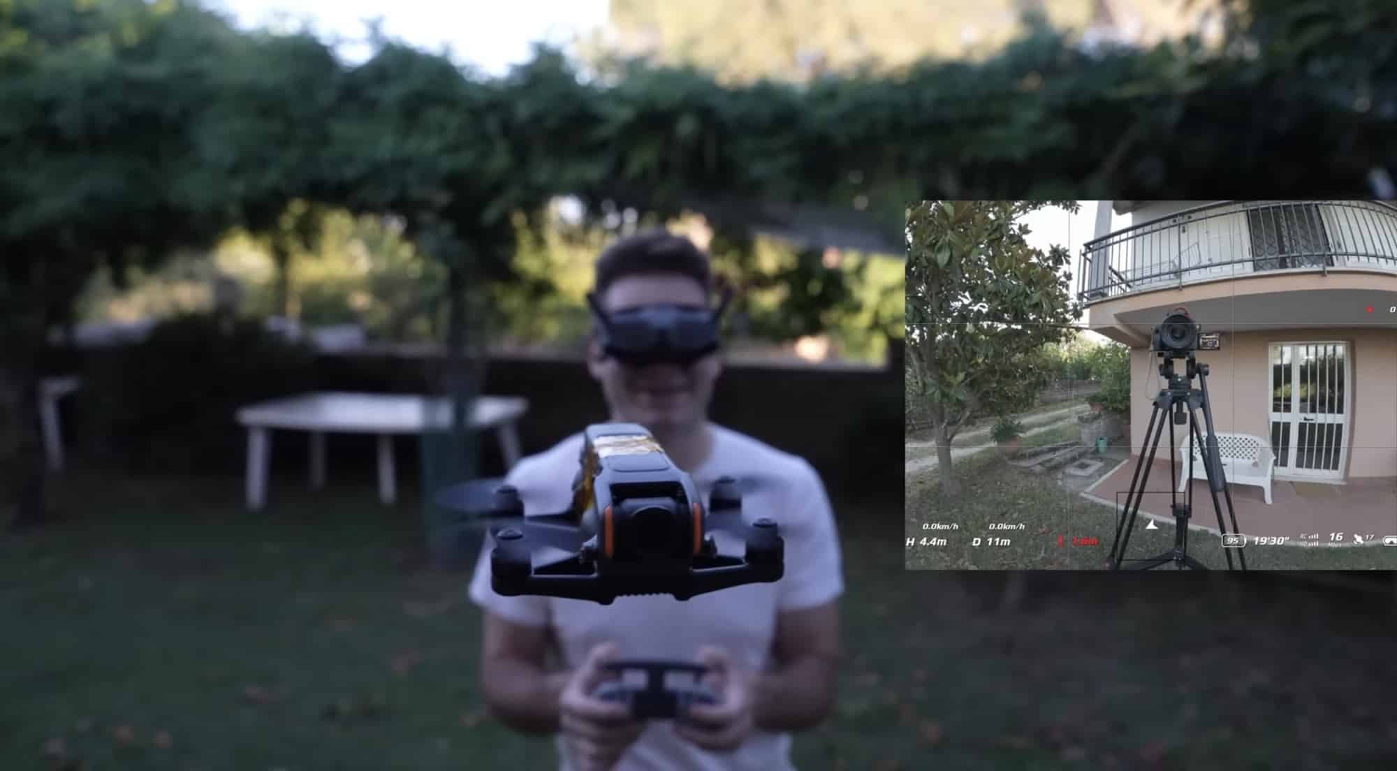 Rimzler flying the modified Avata 2 in goggles, the drone feed inset at right.