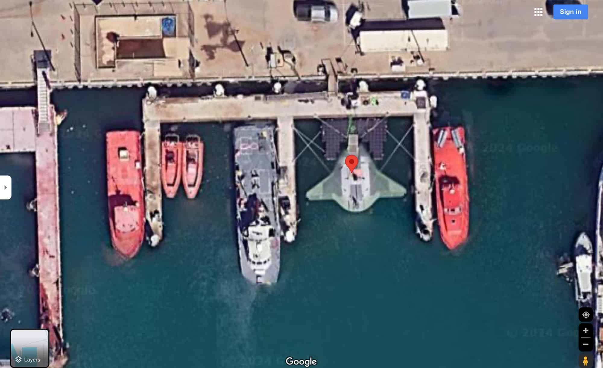 Screenshot of satellite imagery showing a manta-shaped craft moored at Port Hueneme.
