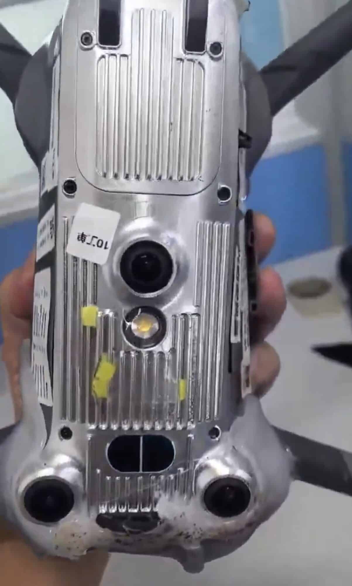 Underside of the prototype showing heatsink fins and downward vision sensors.