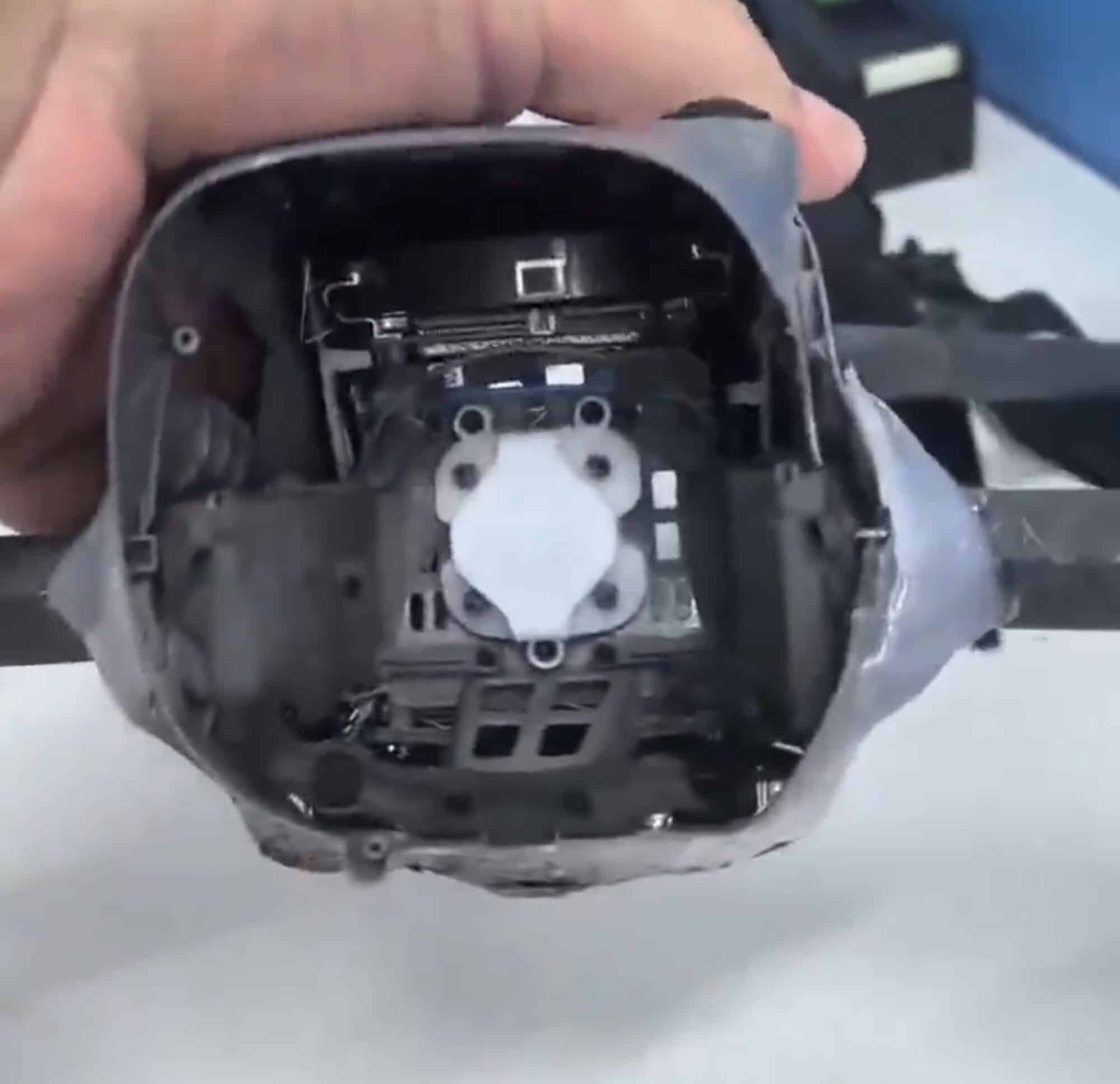 Empty gimbal bay in the drone nose after the camera module was removed.