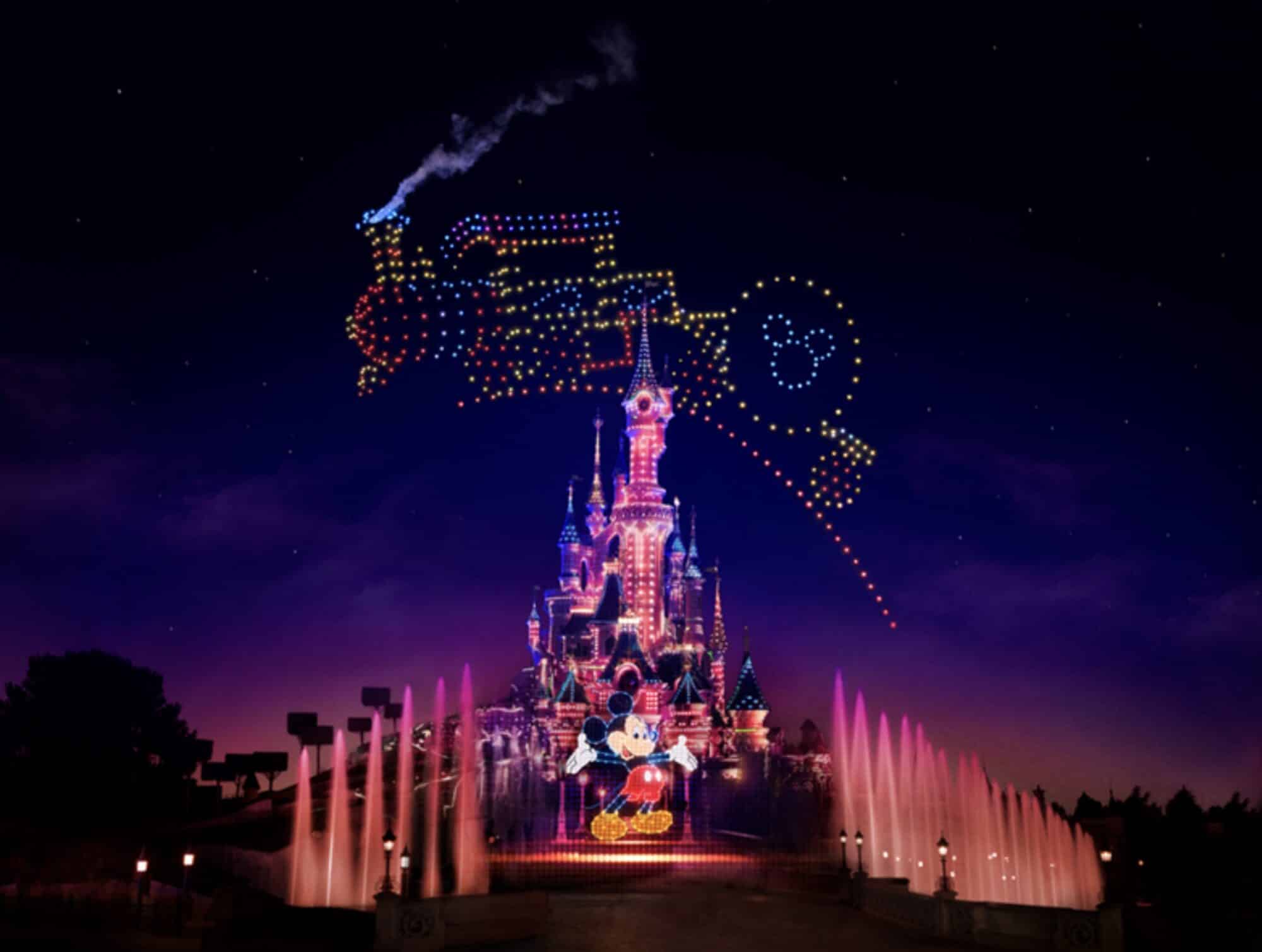 Drones form a tricolor Mickey Mouse head above the illuminated Sleeping Beauty Castle.