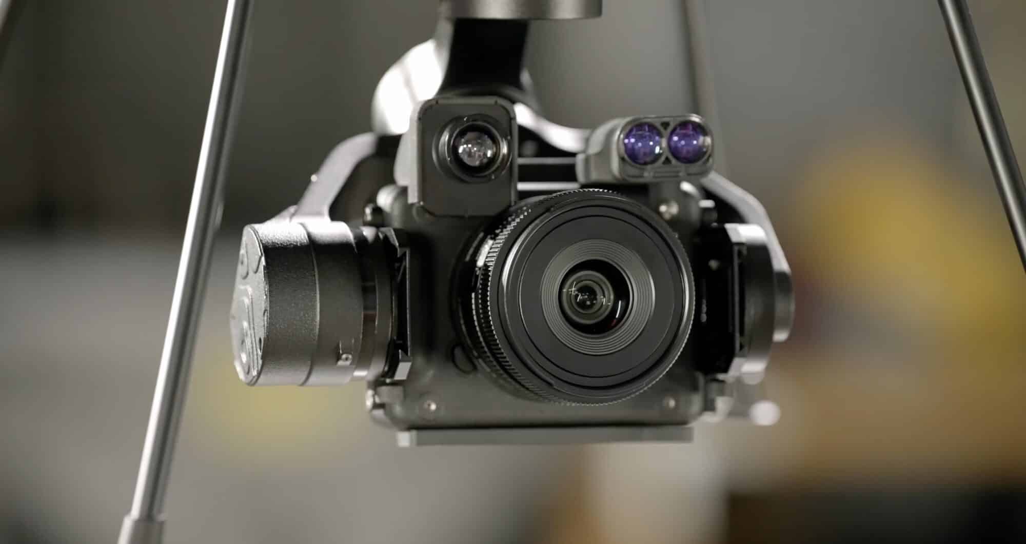 Close-up of the gimbal carrying a mirrorless camera and paired sensor pods.