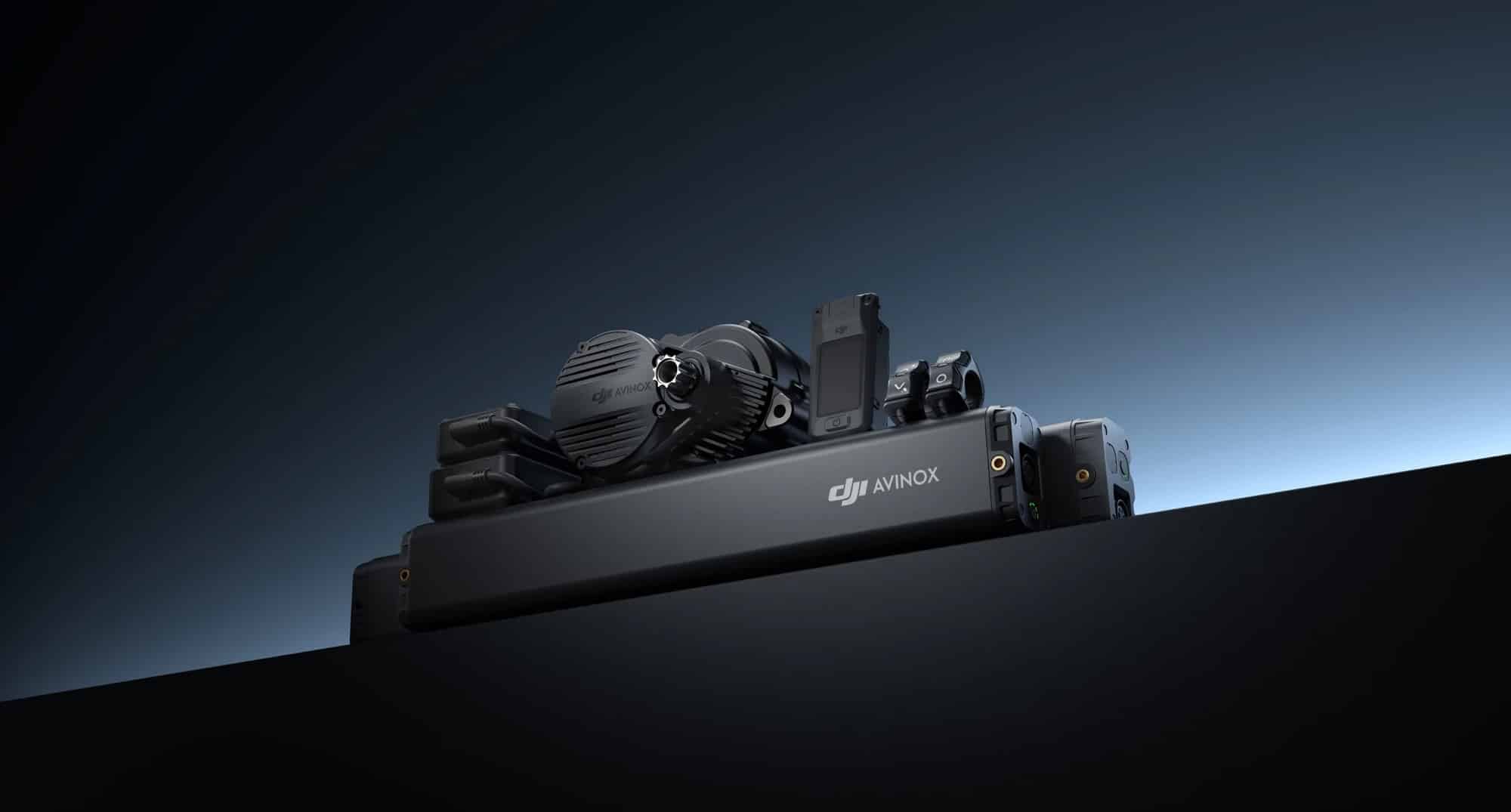 DJI Avinox drive unit and battery pack posed on a dark studio surface.