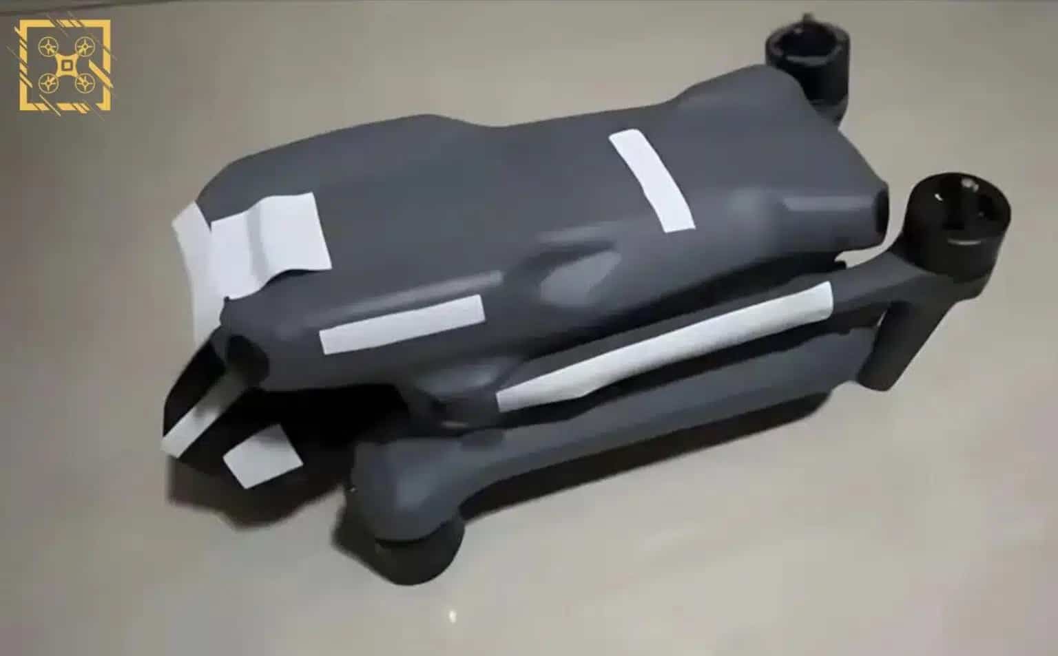 Leaked photo of a folded DJI drone with the camera area taped over.