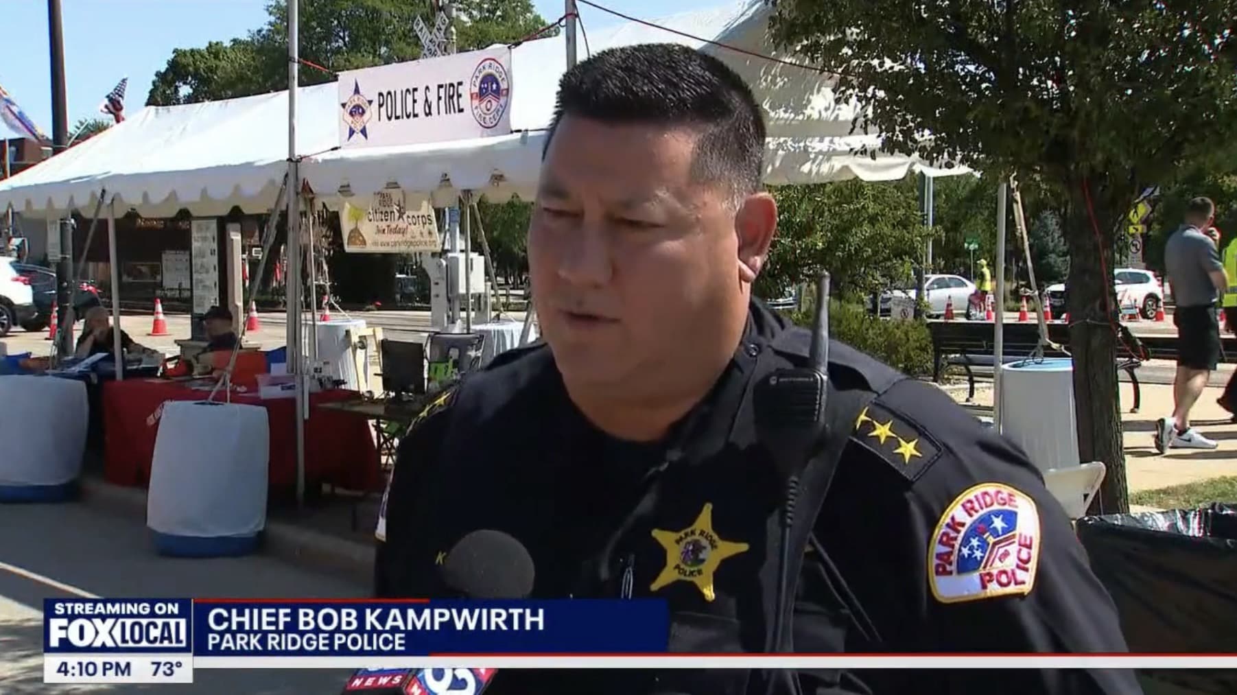 Park Ridge Police Chief Bob Kampwirth interviewed among the festival tents.