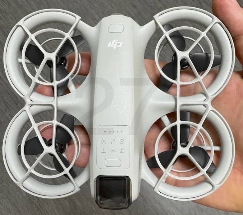 Leaked DJI Neo held in a hand, showing full-coverage propeller guards from above.