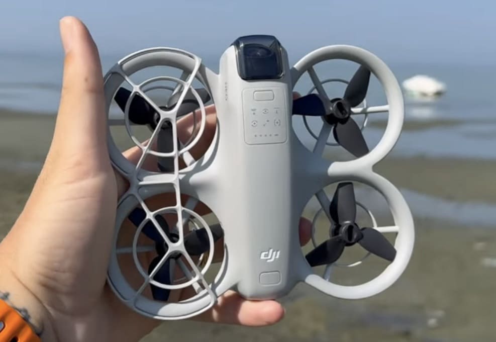 The DJI Neo held in hand, flyable from a smartphone with no controller.