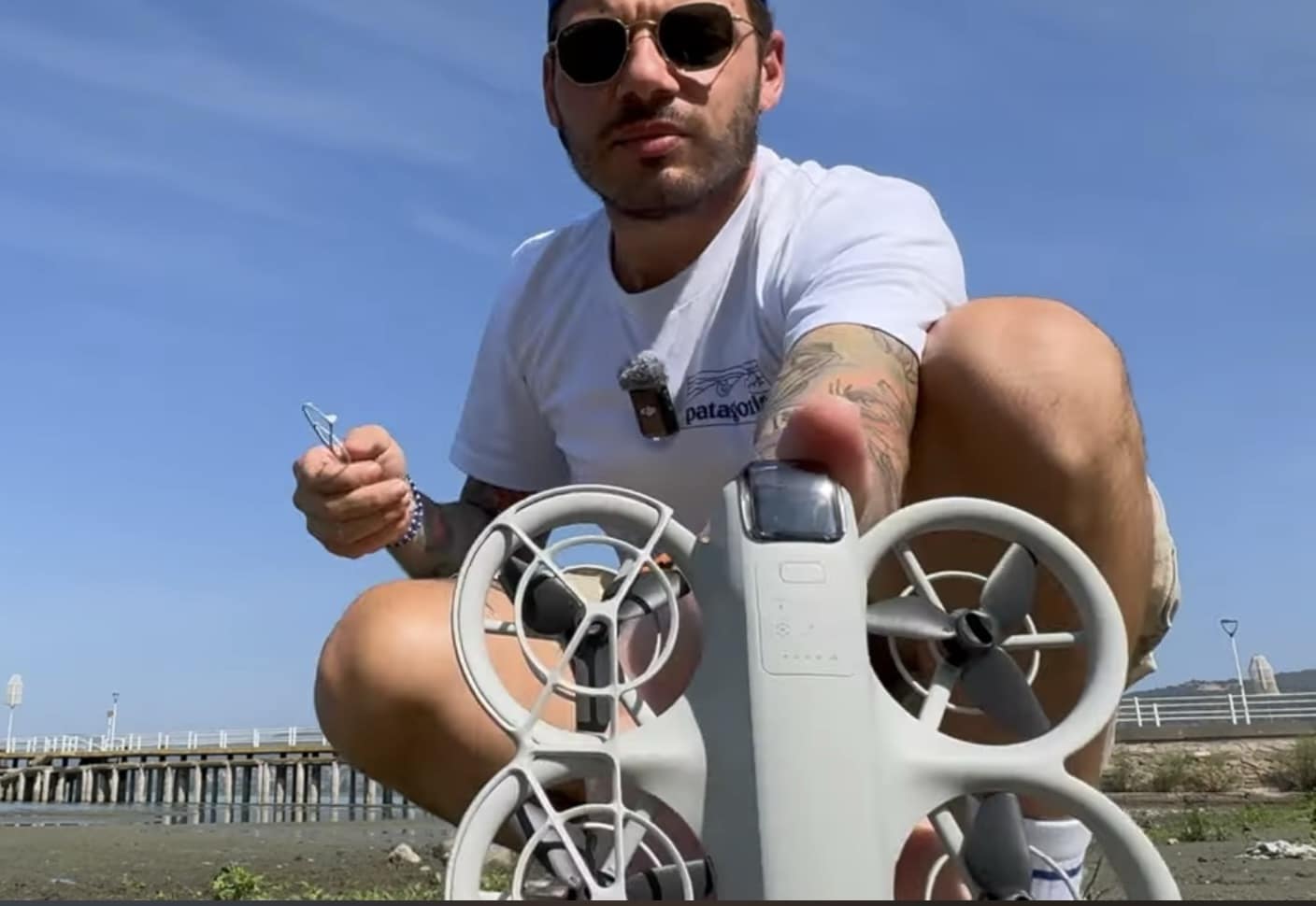 A prop guard being snapped off the DJI Neo airframe.