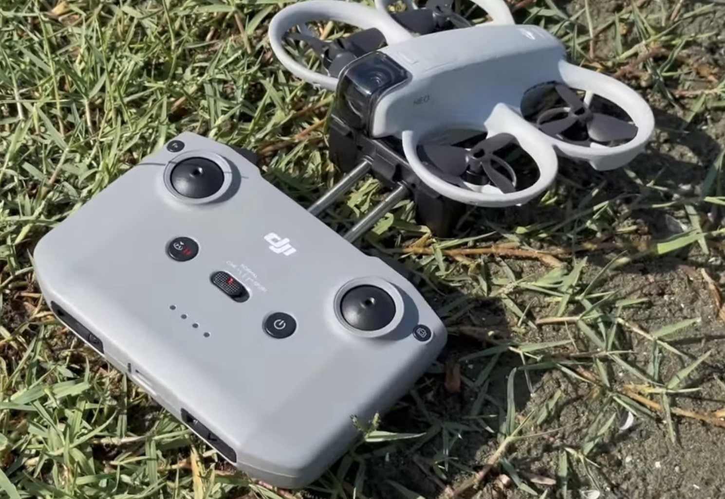 The DJI RC-N3 controller sitting beside the DJI Neo.