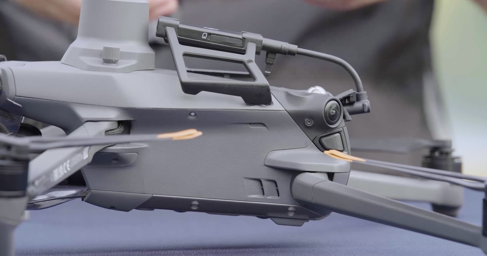 Cellular dongle clamped to the top arm of a Mavic 3 Enterprise airframe.
