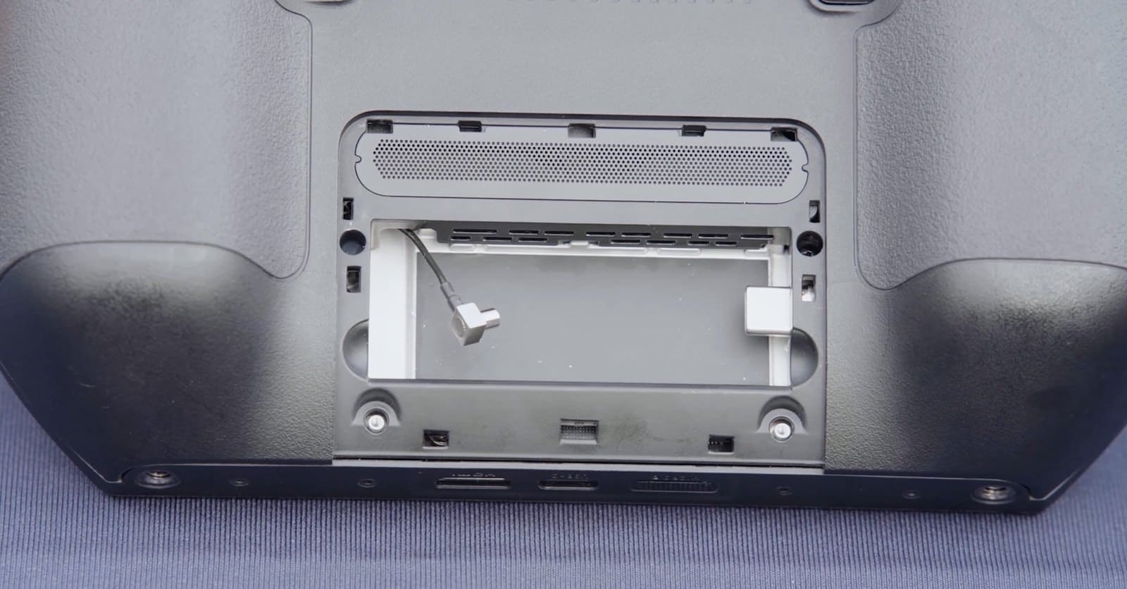 Open rear bay of the controller showing the empty dongle slot and connector.
