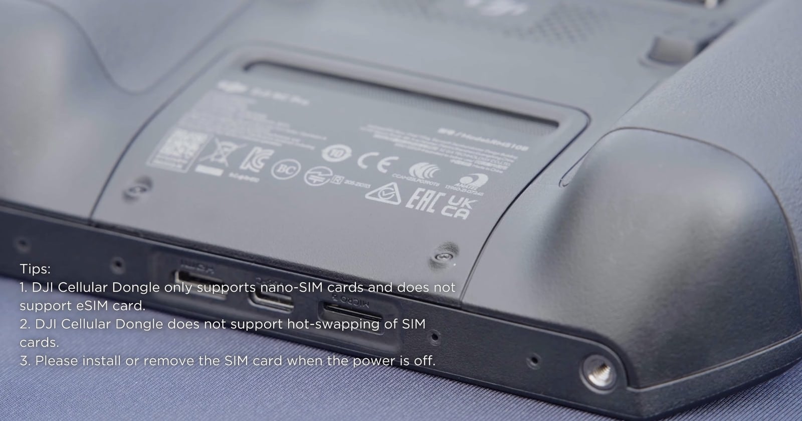 Onscreen tips noting the dongle takes nano-SIM cards only and cannot hot-swap them.