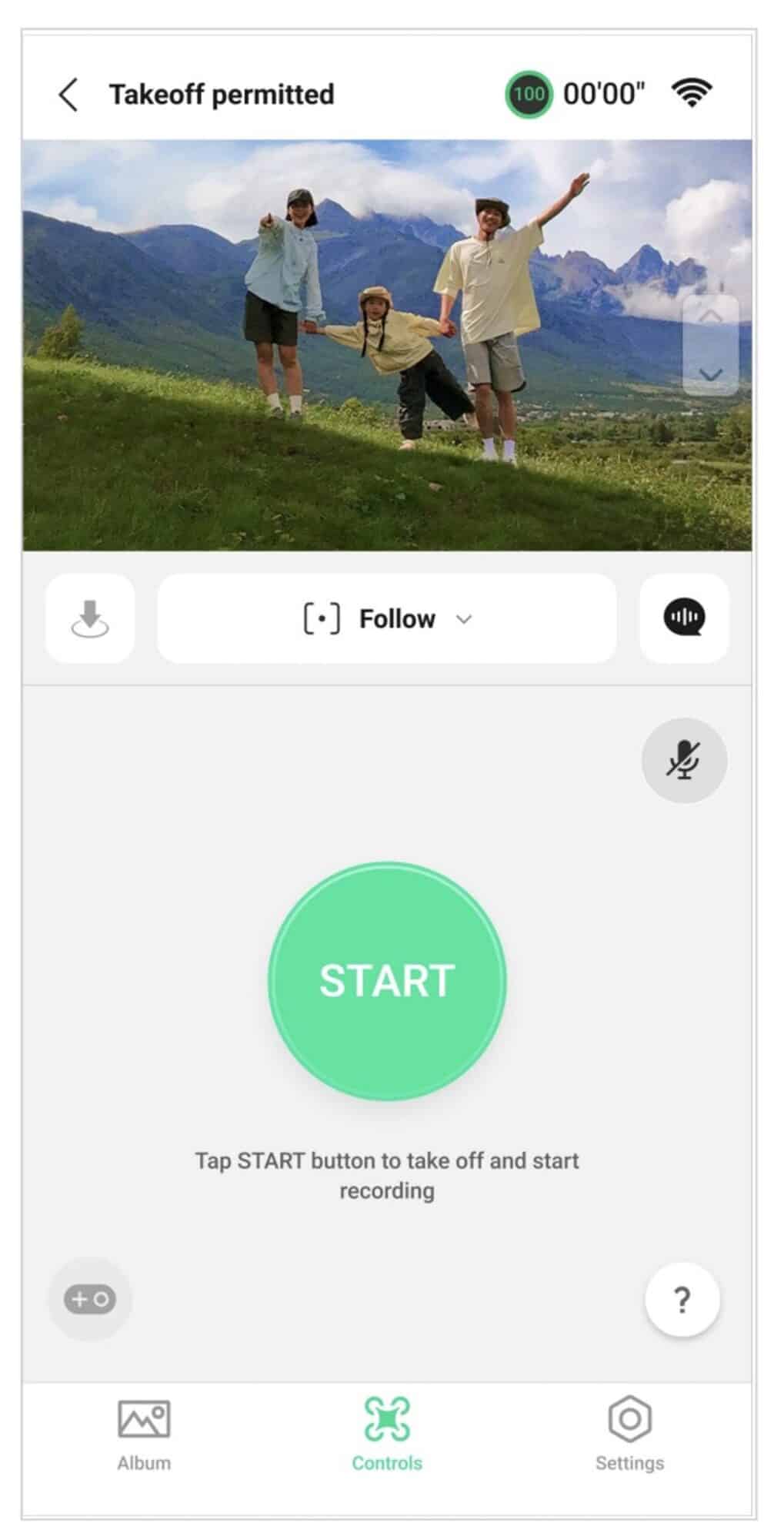 App screen with a large green START button above a family in a mountain meadow.