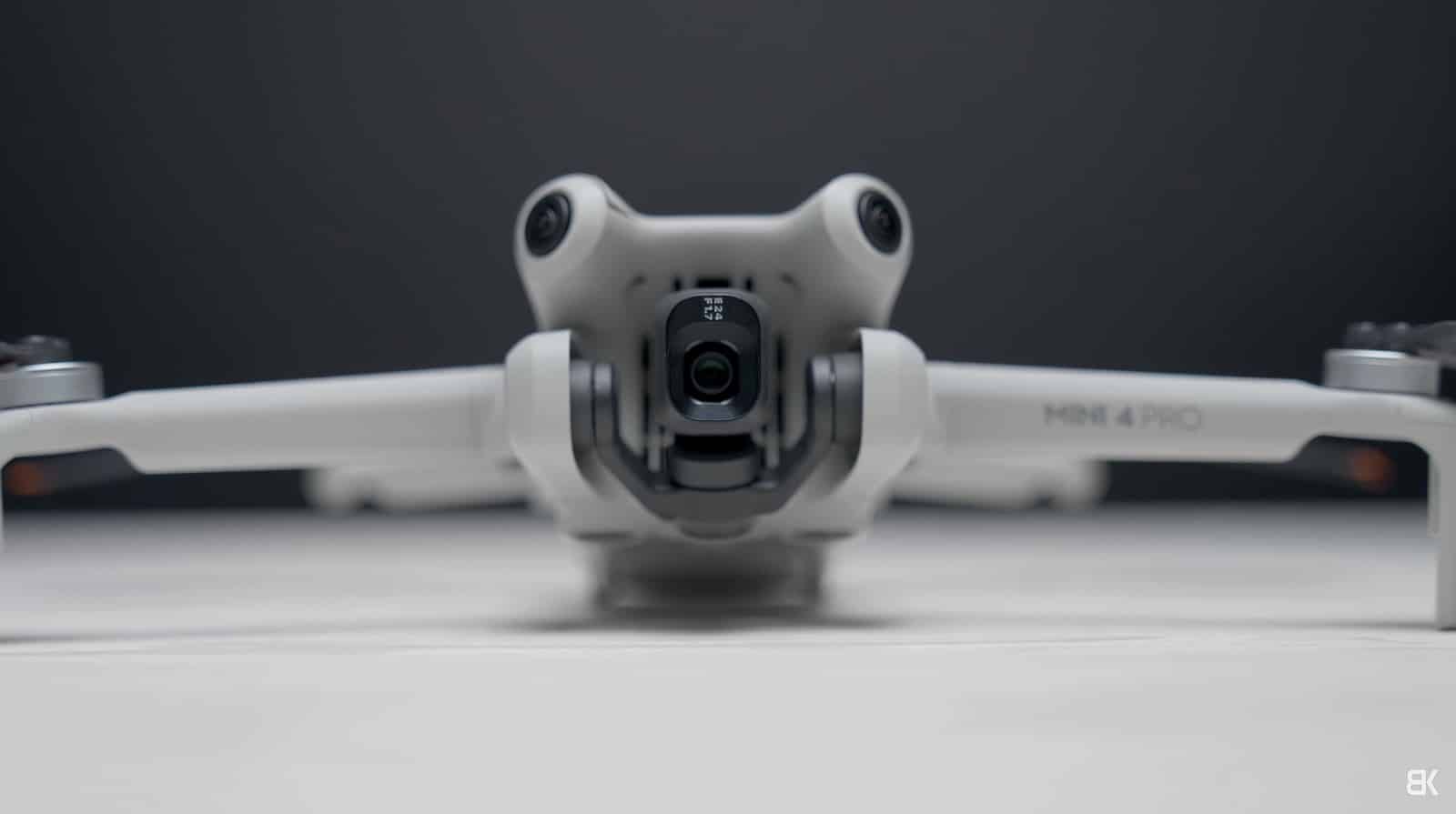 DJI Mini 4 Pro on a desk with its gimbal camera turned to portrait orientation.
