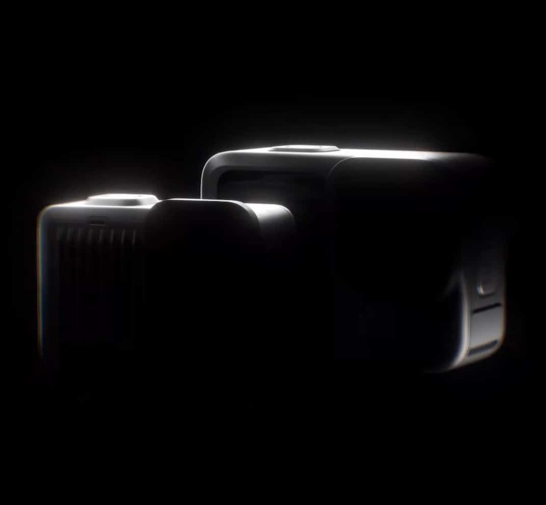 GoPro teaser image showing two darkened Hero 13 cameras side by side.