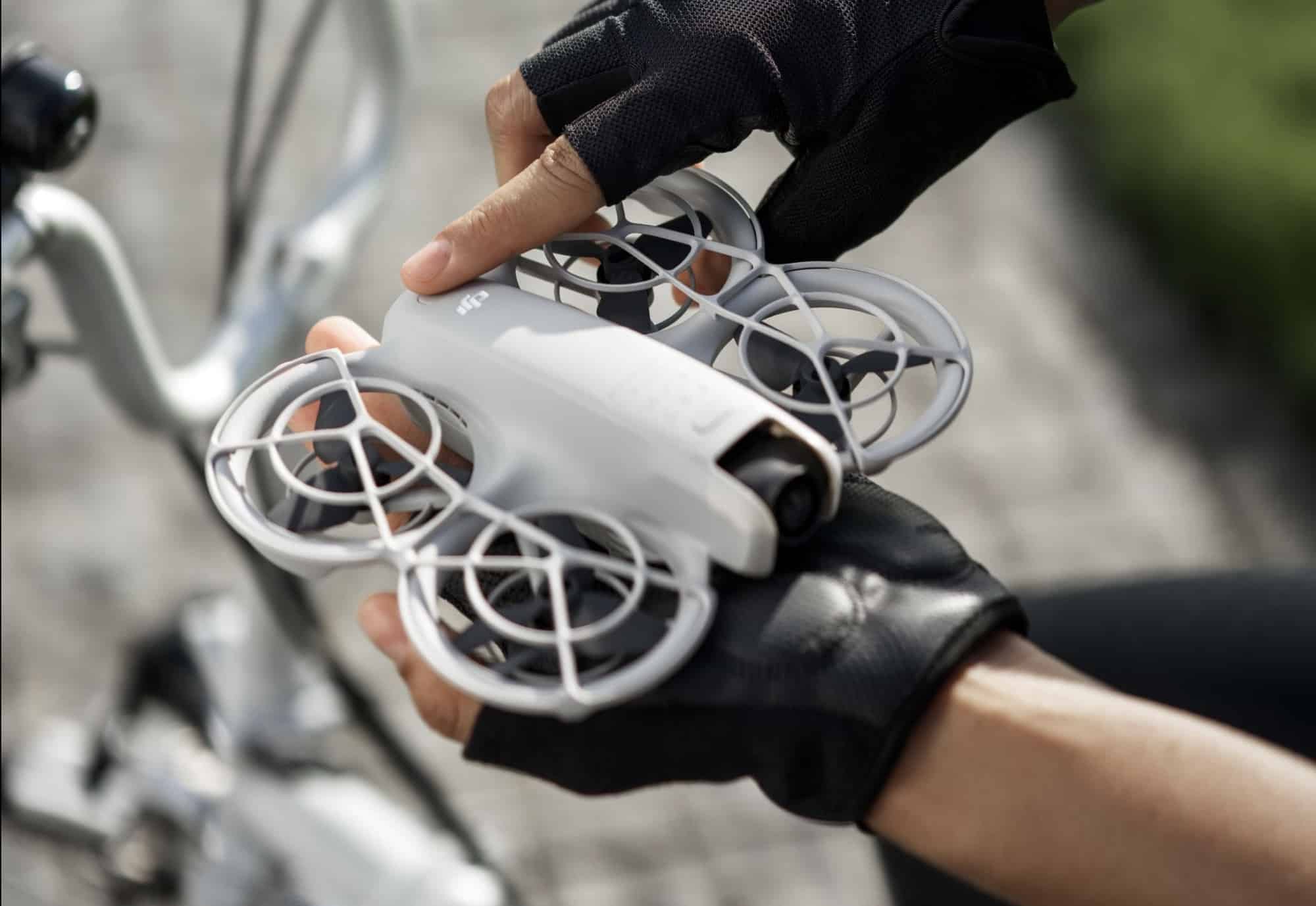 The DJI Neo lifting off from an outstretched palm with no remote controller.
