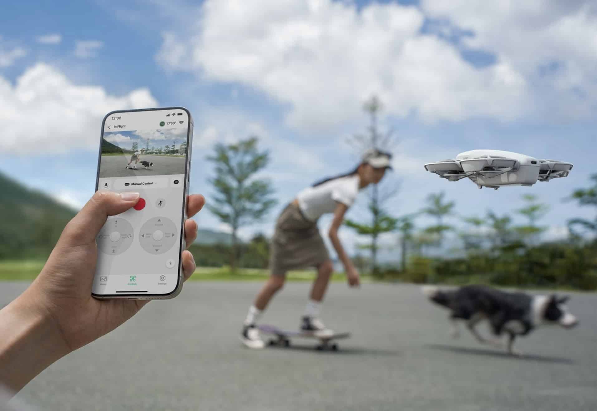 Phone-based virtual joysticks steer the Neo as a skateboarder and dog pass.