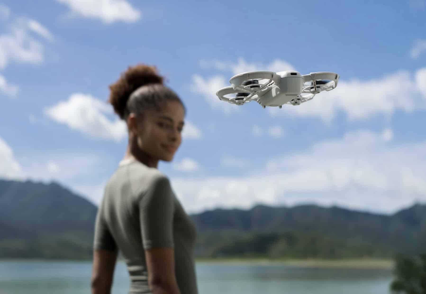 The Neo hovers at head height as a woman glances back over her shoulder.
