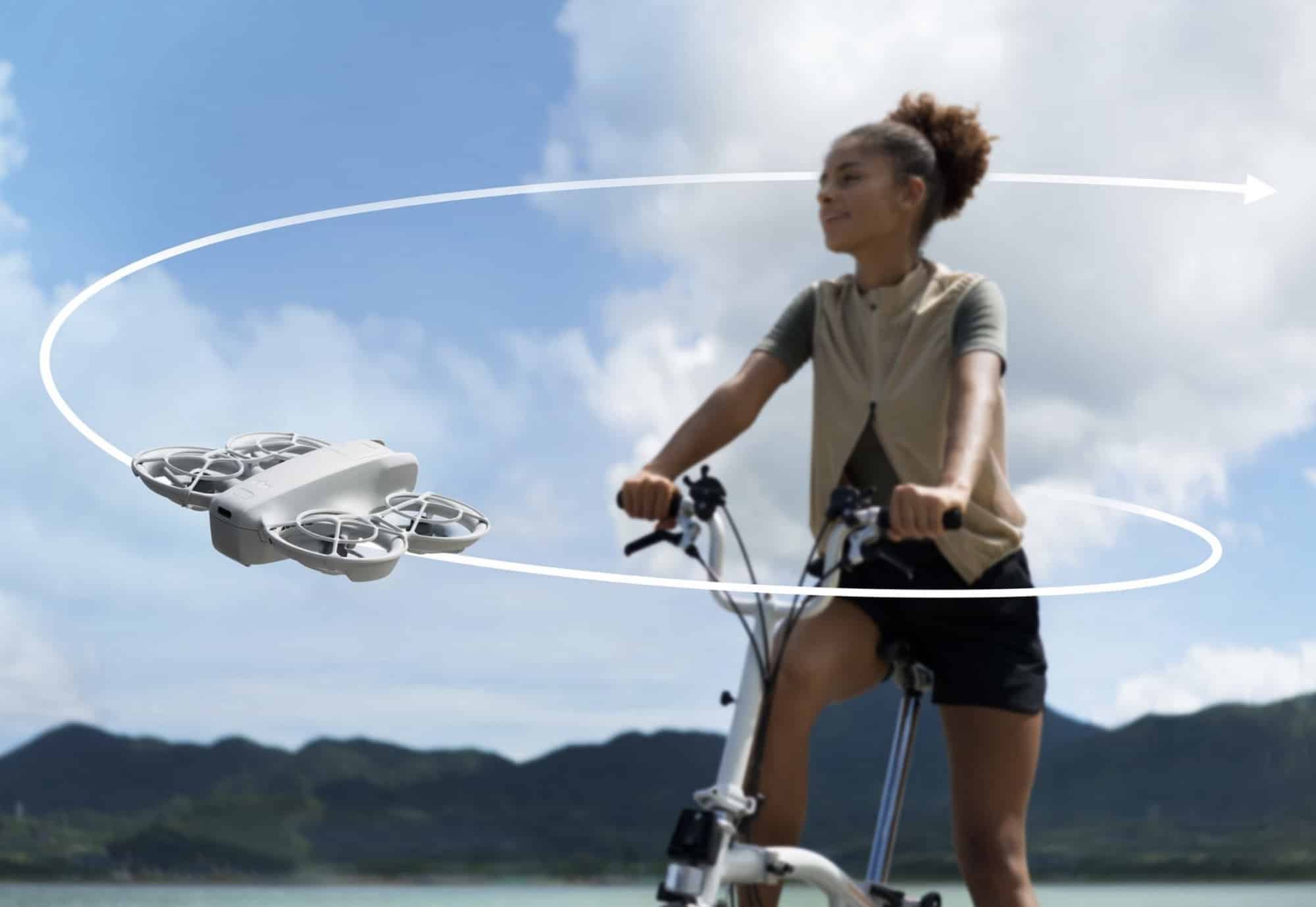 A cyclist on a folding bike as the Neo circles her beside a lake.