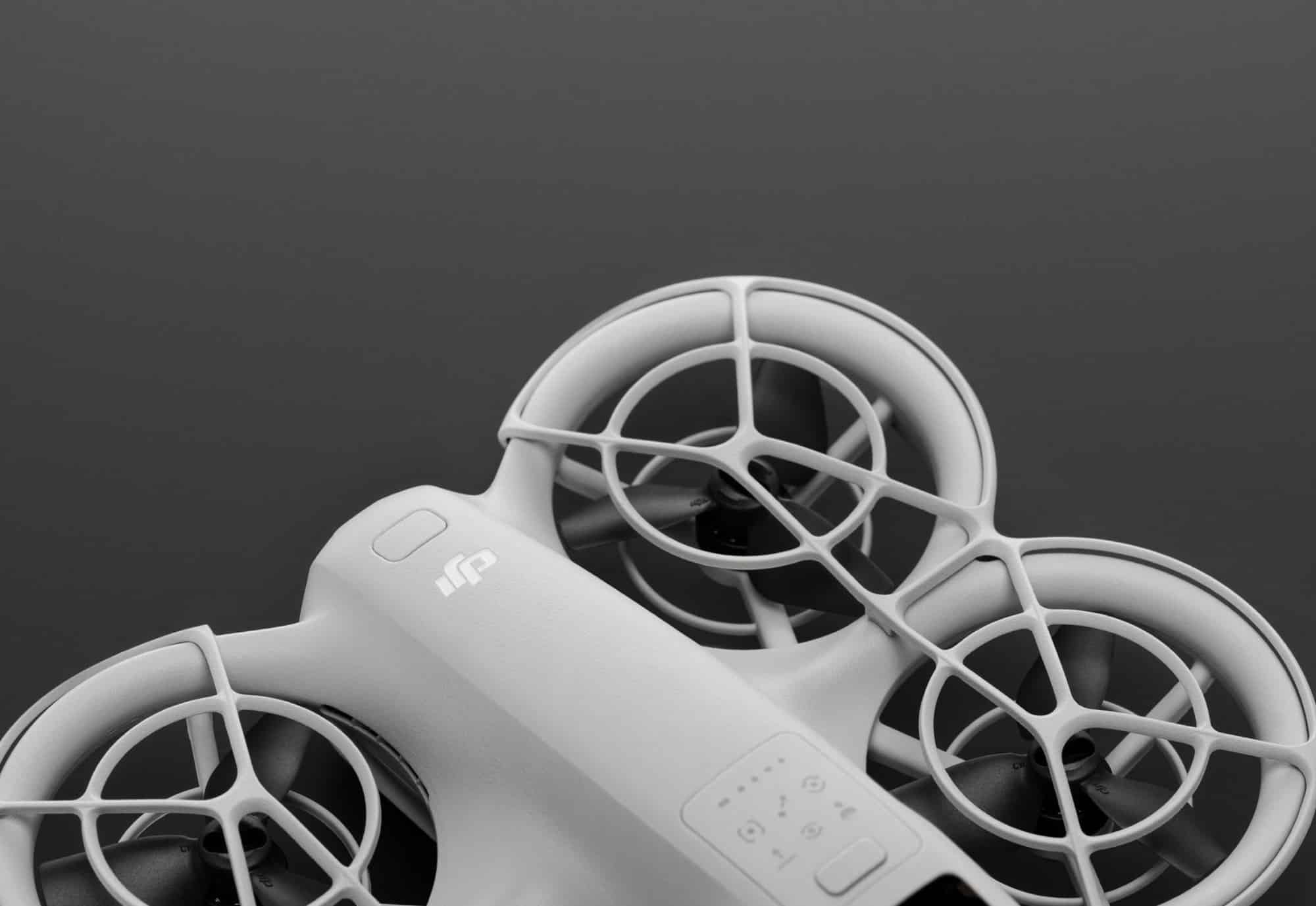 Studio close-up of the Neo's rotor cages and airframe against a dark backdrop.