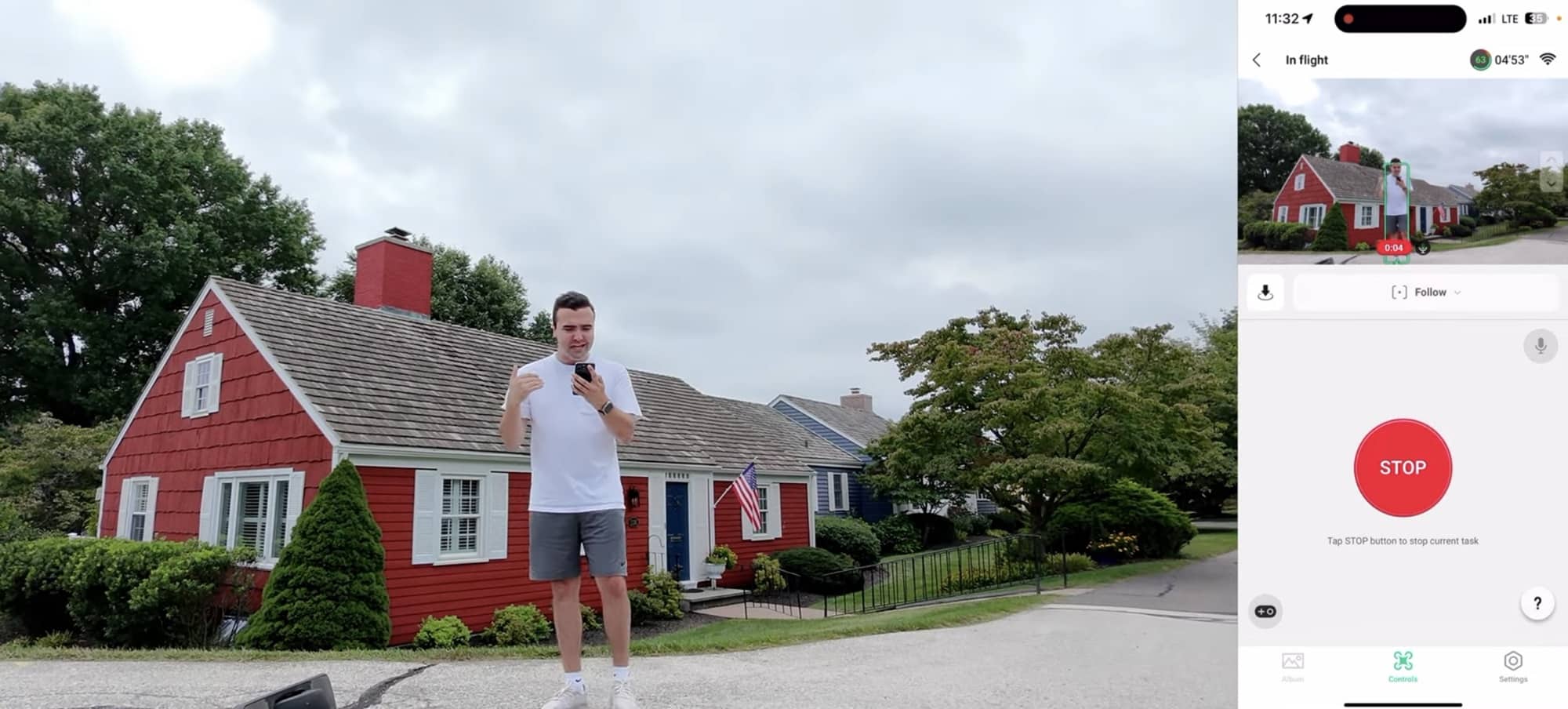 Pilot in front of a red clapboard house with the Follow mode stop button showing.
