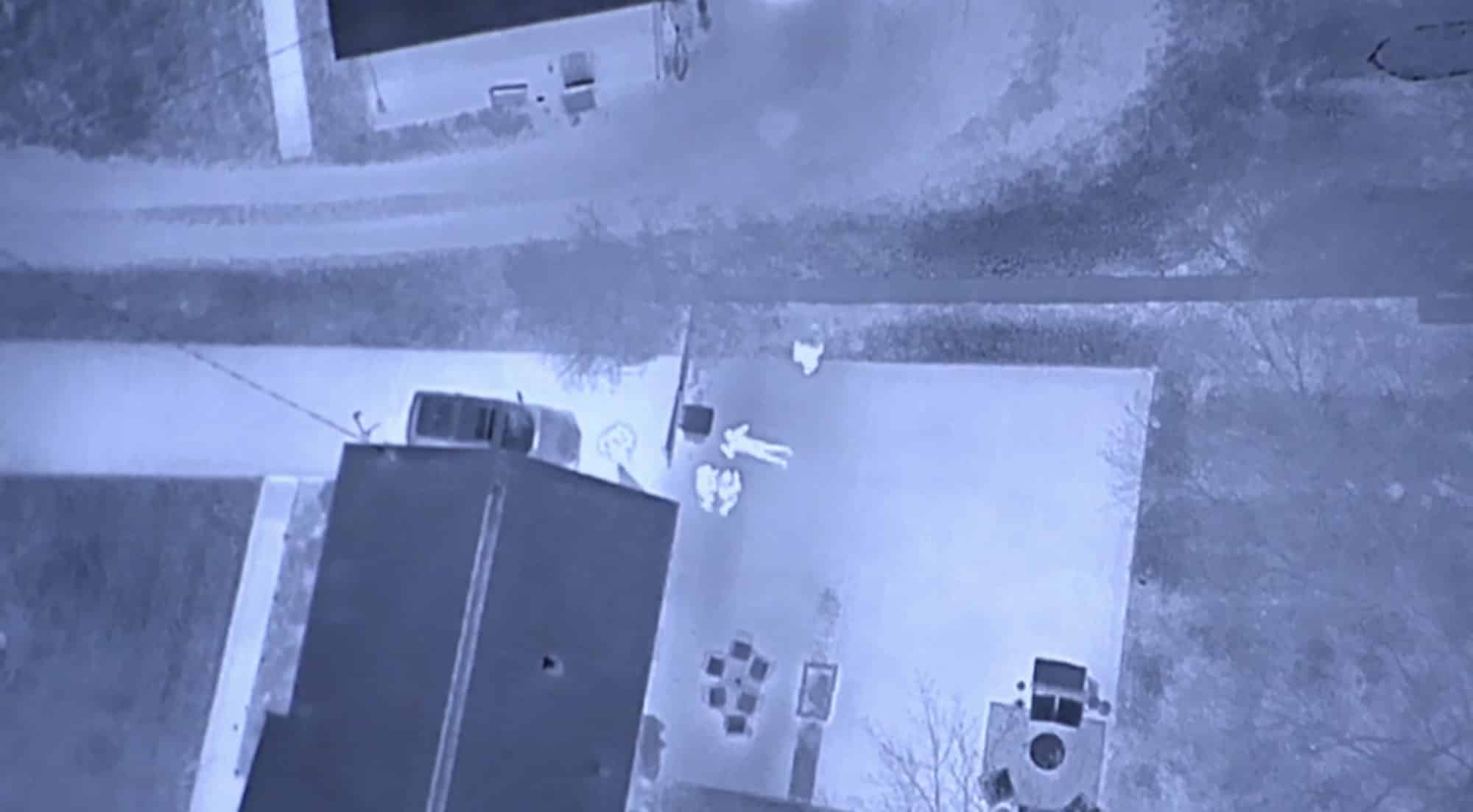 Thermal drone footage shows the suspect's heat signature beside a Hendersonville house.