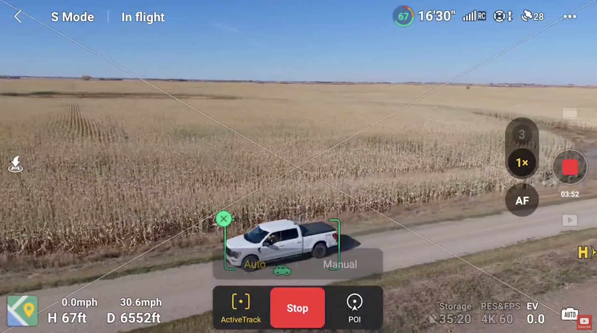 DJI Air 3S tracking a moving vehicle with Active Track on a gravel road.