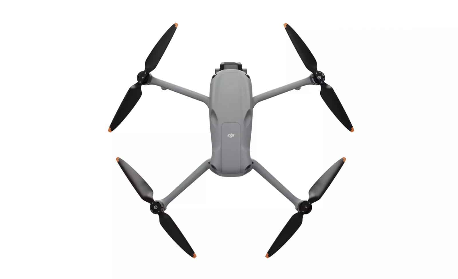 Top-down studio view with all four propellers unfolded and the DJI logo visible.