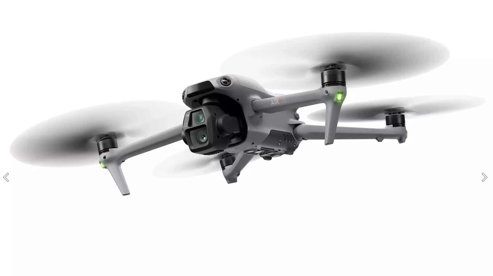 Studio shot of the drone hovering with propellers blurred against a white backdrop.