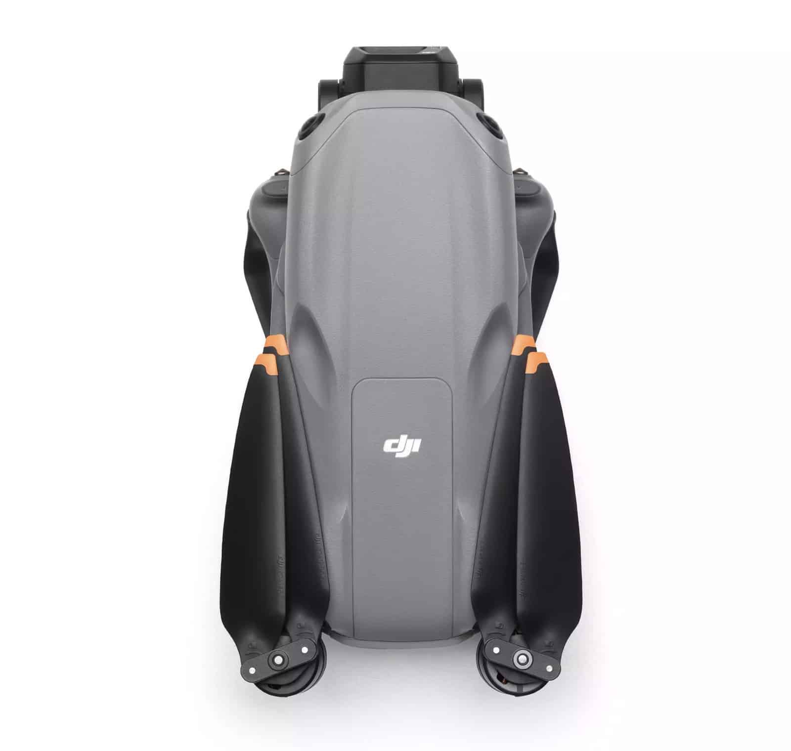 Folded drone seen from the rear, propeller blades stowed against the gray shell.