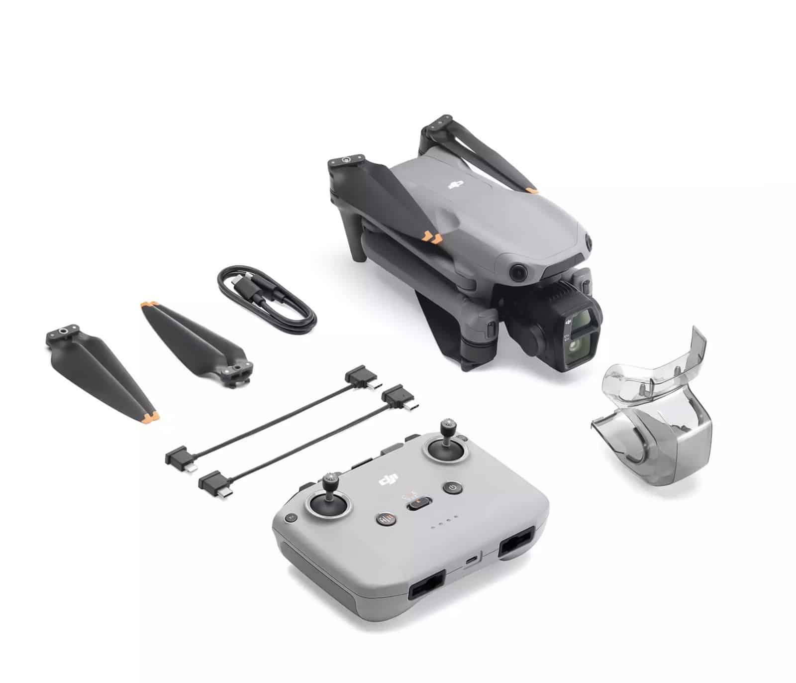 Standard kit laid out with the drone, a screen-free controller, spare propellers and cables.