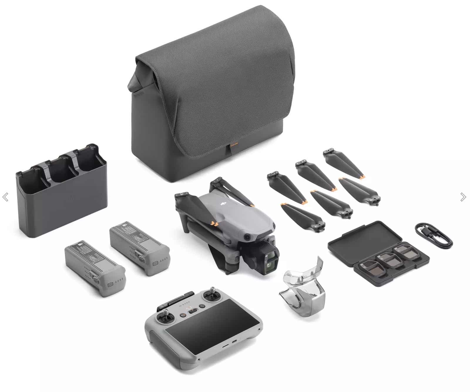 Fly More Combo flat lay with shoulder bag, charging hub, batteries, screen controller and filters.