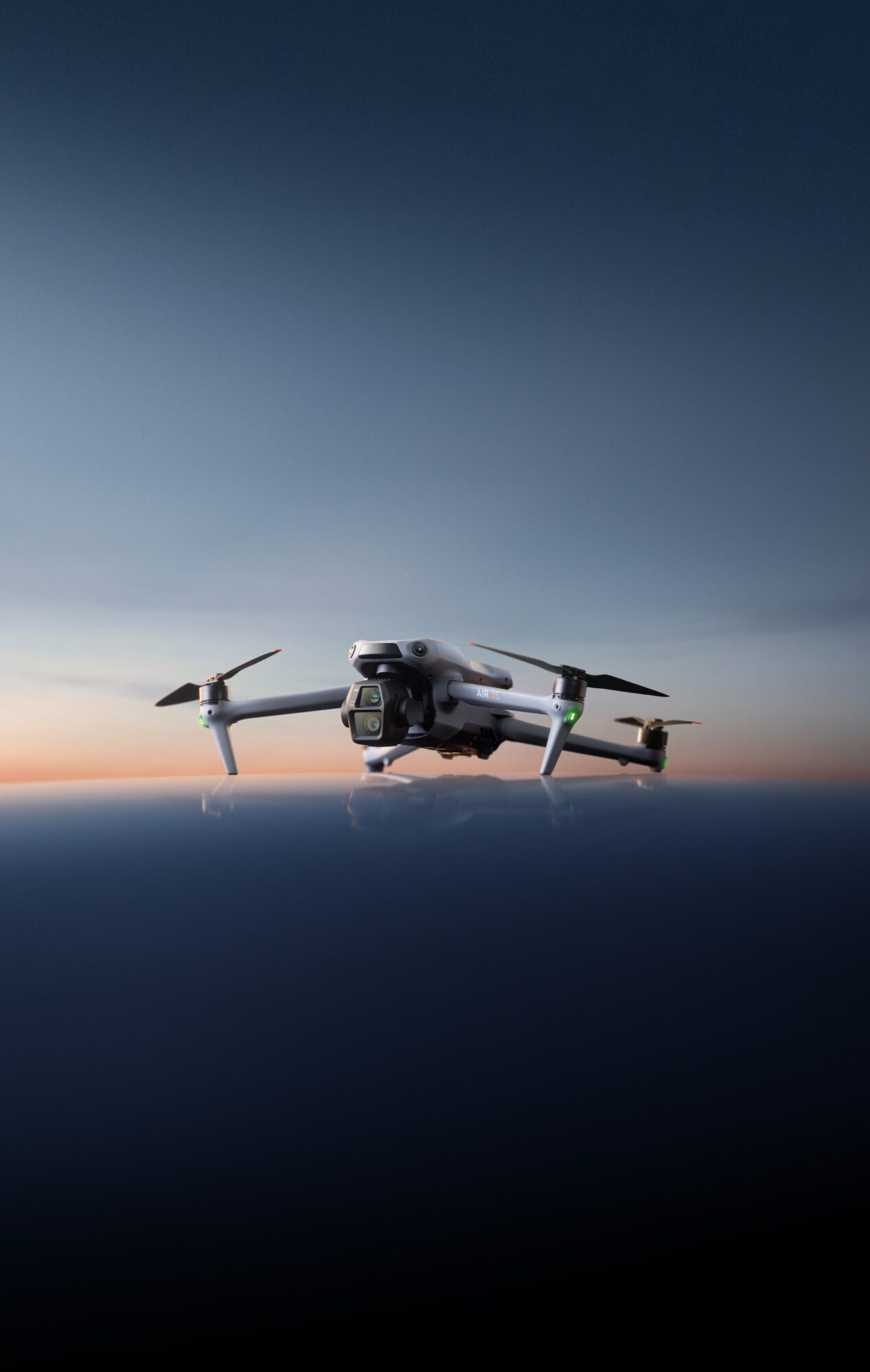 Vertical poster of the Air 3S hovering above a dark twilight water gradient.
