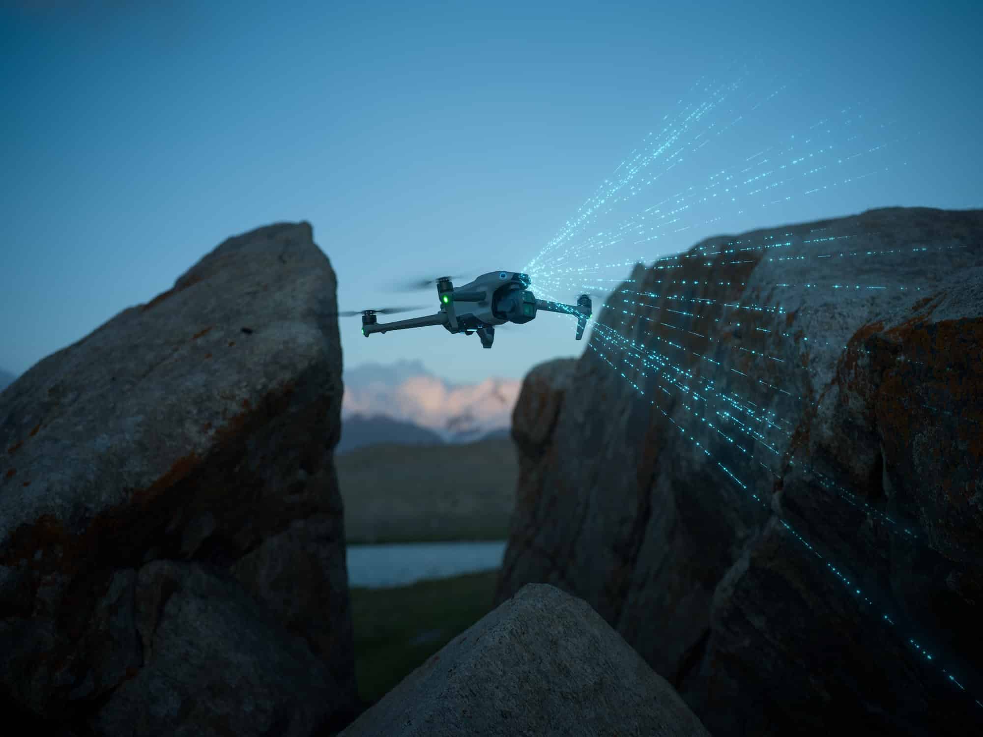 Air 3S scans a rock face with cyan LiDAR beams while flying through a gap.