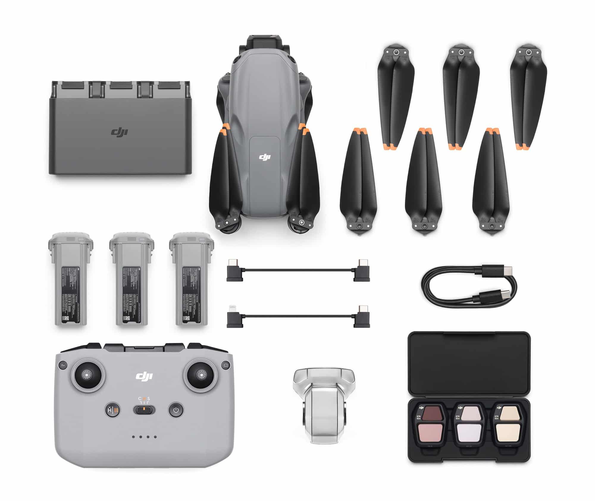 Flat overhead layout of the drone, six propellers, three batteries and accessories.
