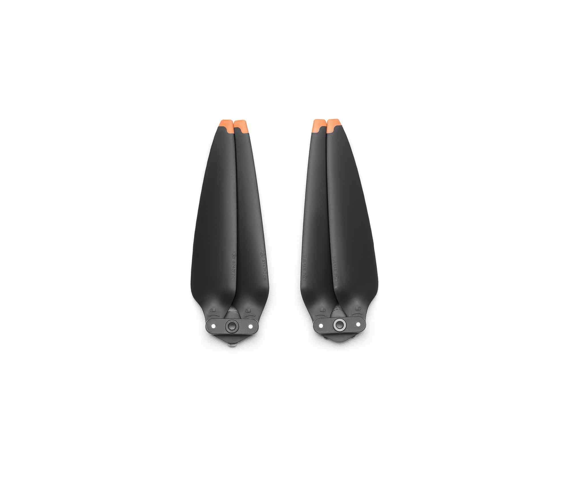 Pair of low-noise propellers with blades folded together and orange tips up.