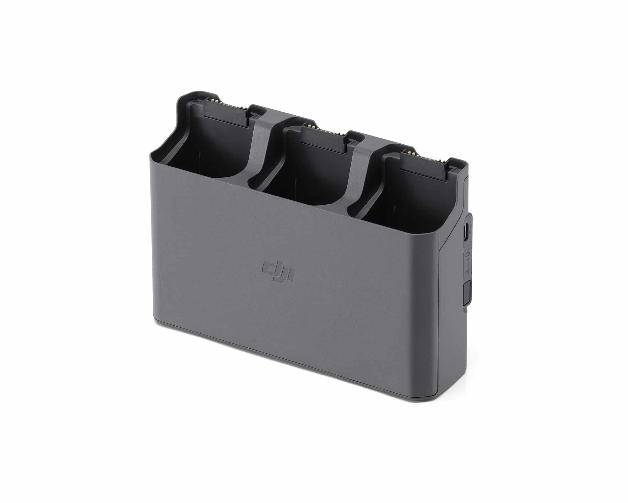 Empty three-bay charging hub angled to show its open battery slots.