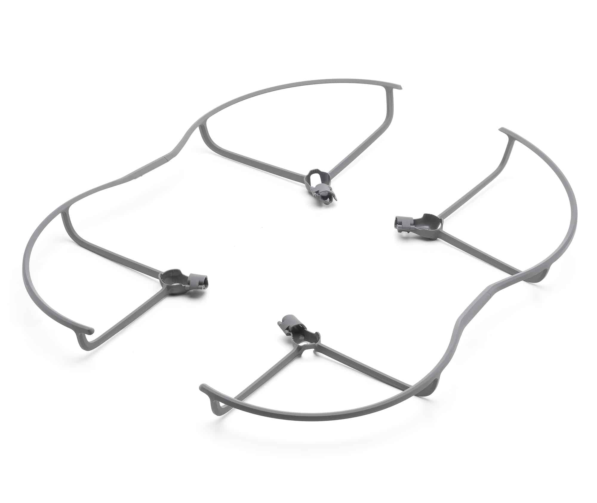Four propeller guards resting loosely at angles on a white backdrop.