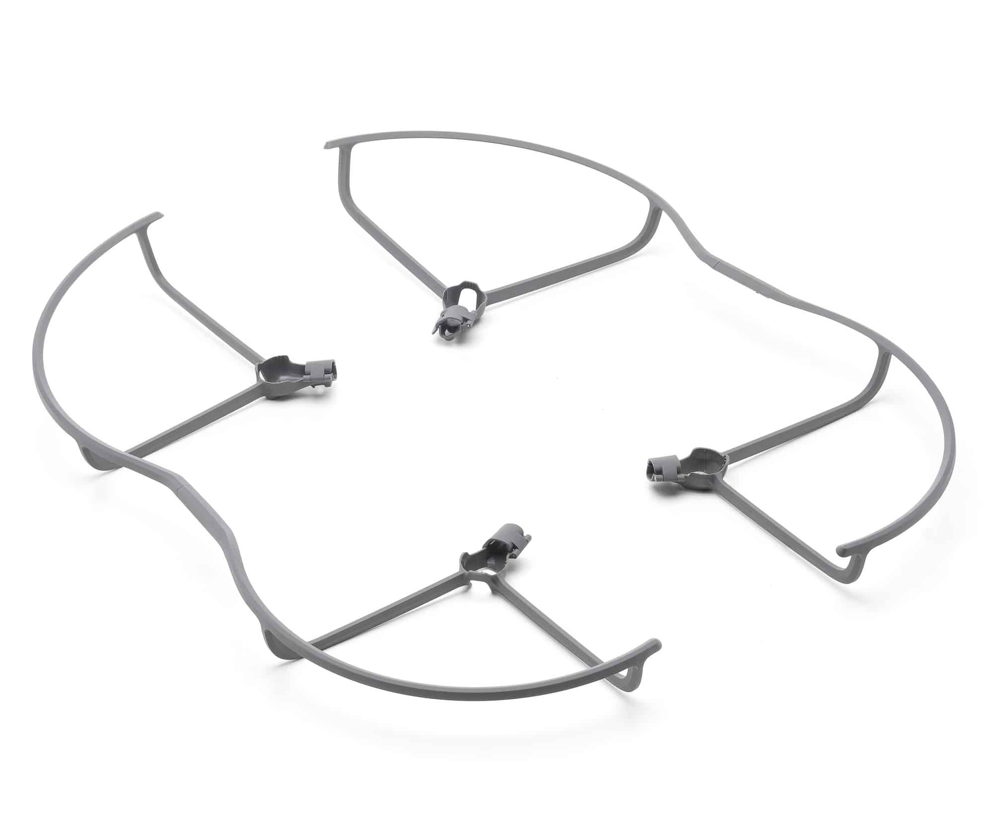 Four unmounted propeller guards spread apart on a white backdrop.