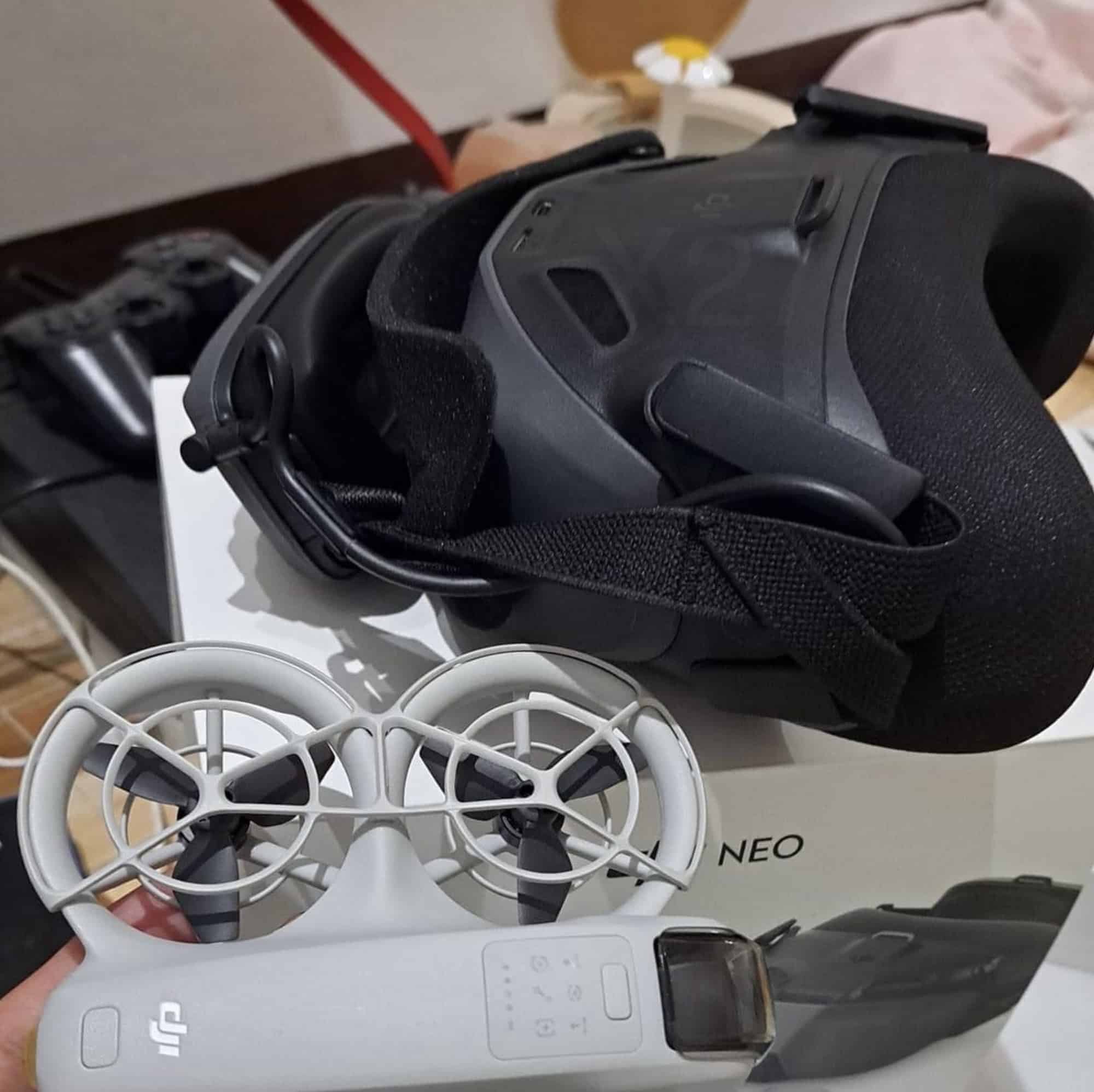 DJI Goggles N3 headset resting on a white DJI Neo drone in its box.