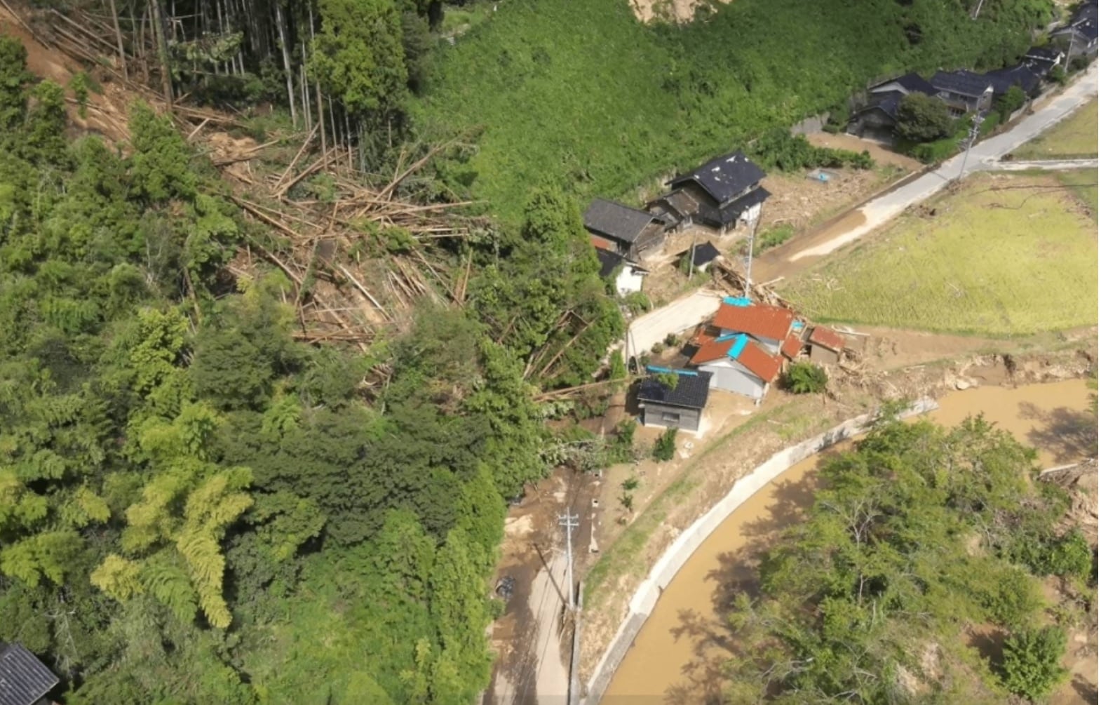 A KDDI SmartDrone captured this striking aerial view last week, revealing a massive landslide triggered by unprecedented rainfall that's completely blocked a road in Ishikawa Prefecture. The image starkly illustrates the destructive power of the recent weather events. (Photo credit: KDDI SmartDrone)