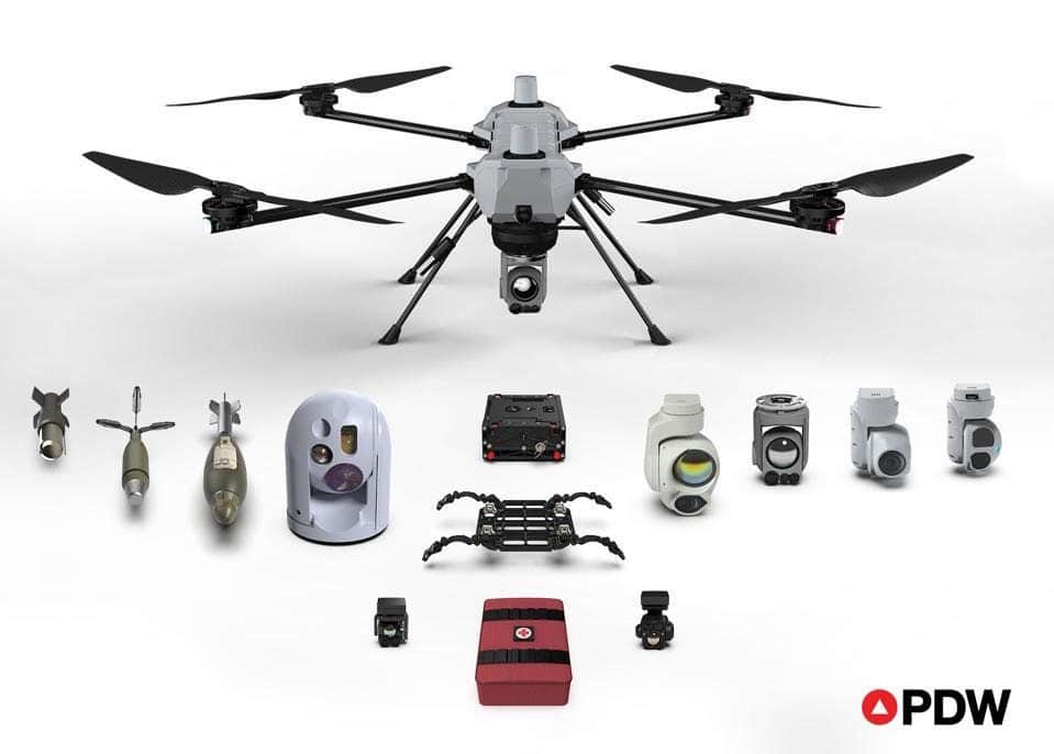 Performance Drone Works C-100 multirotor displayed above its interchangeable payloads, sensors and munitions.