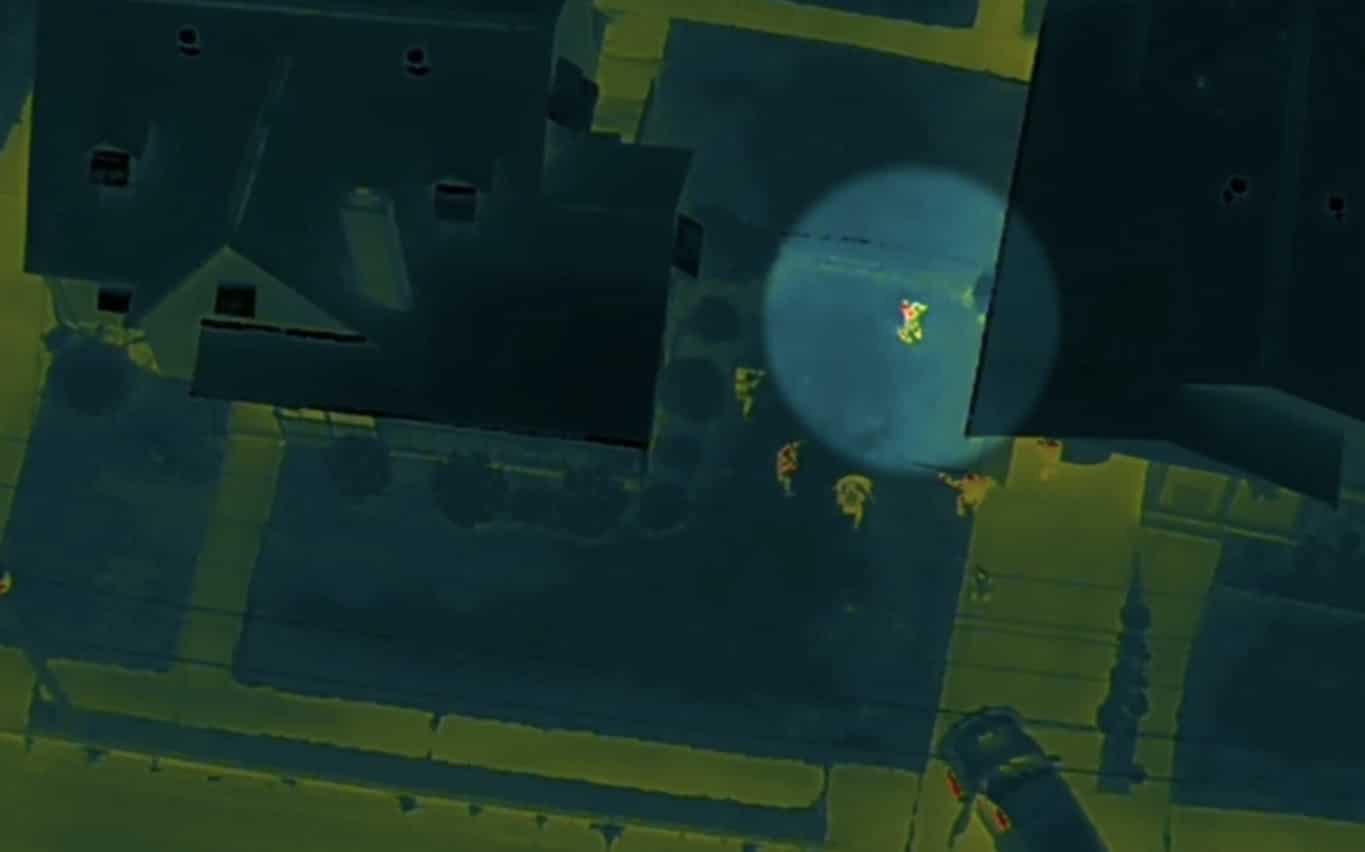 Thermal drone view of a house with yellow heat signatures marking people below.