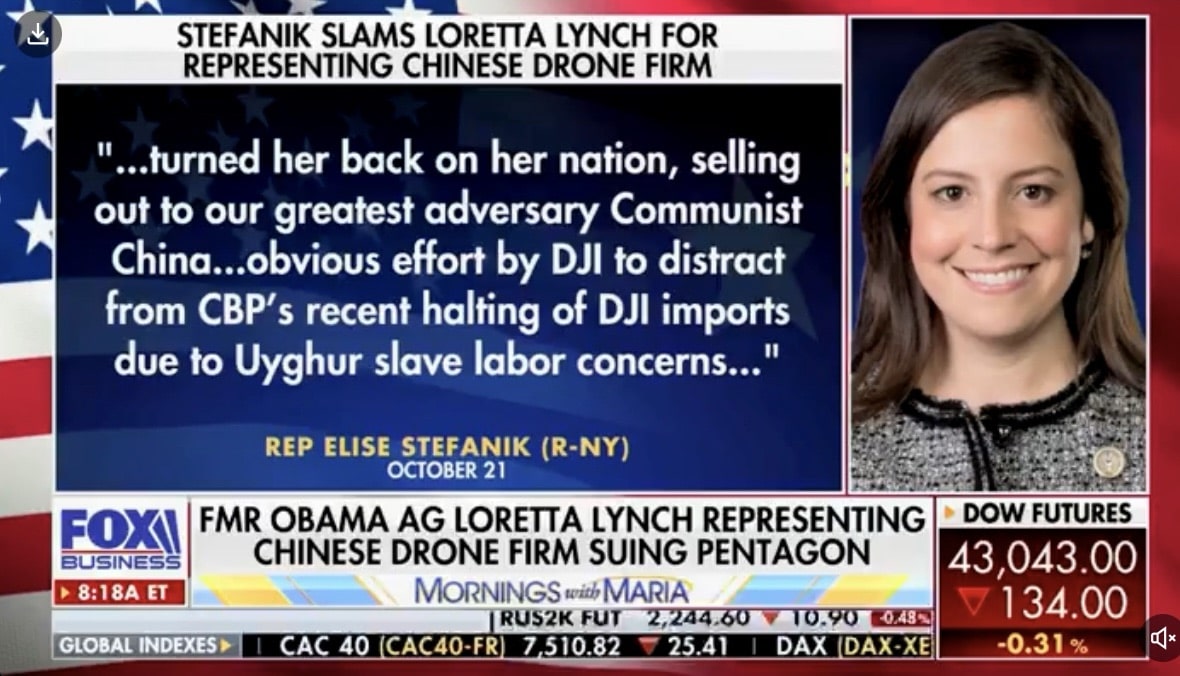 Fox Business segment showing a Stefanik quote about Loretta Lynch representing DJI.