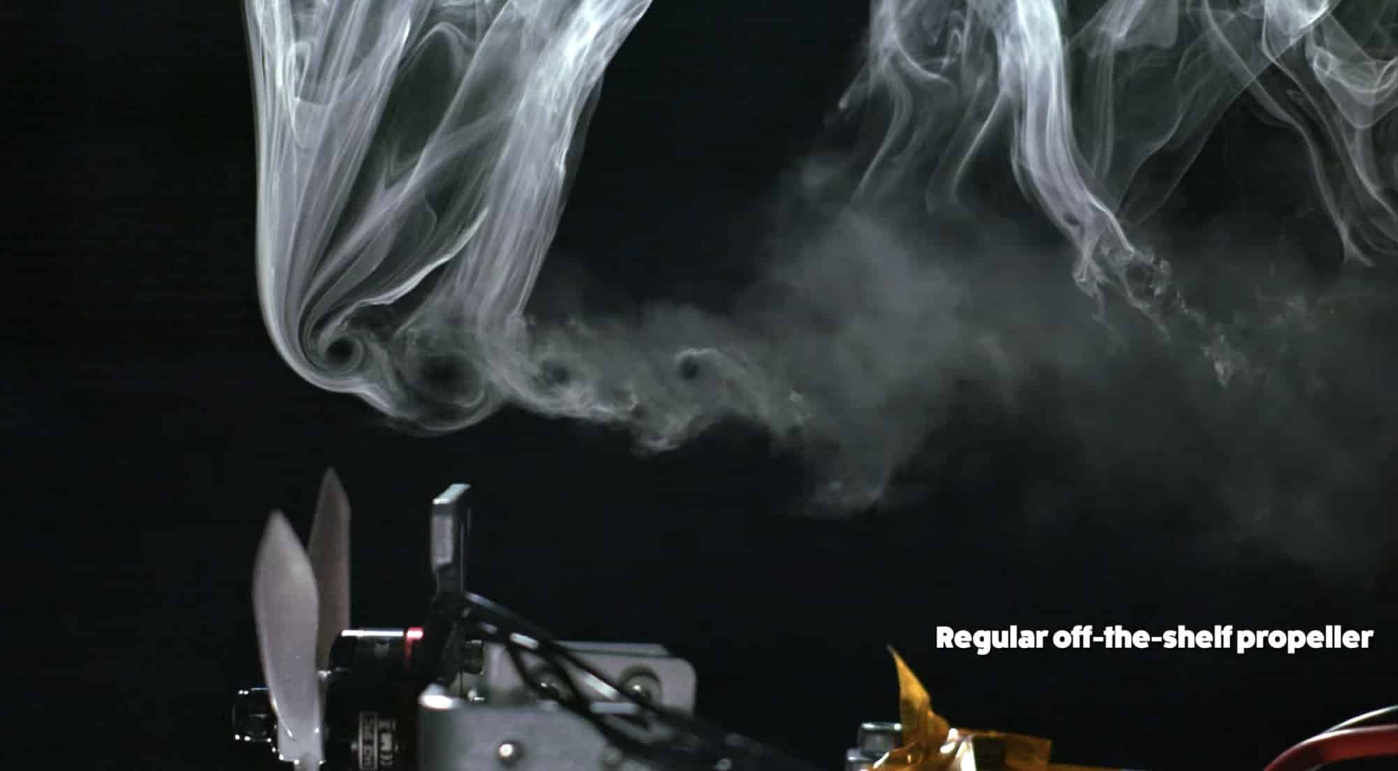 Smoke flow test showing vortices trailing an off-the-shelf propeller on a rig.