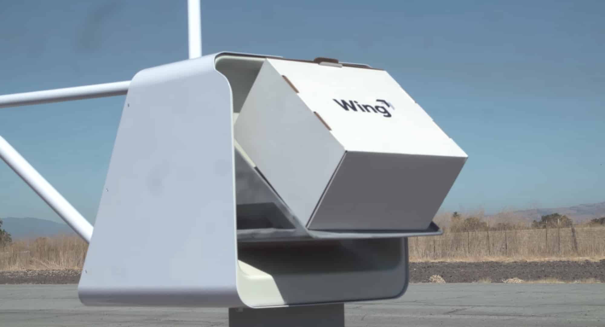 Wing-branded delivery box seated in the aircraft carrier cradle at the test airfield.