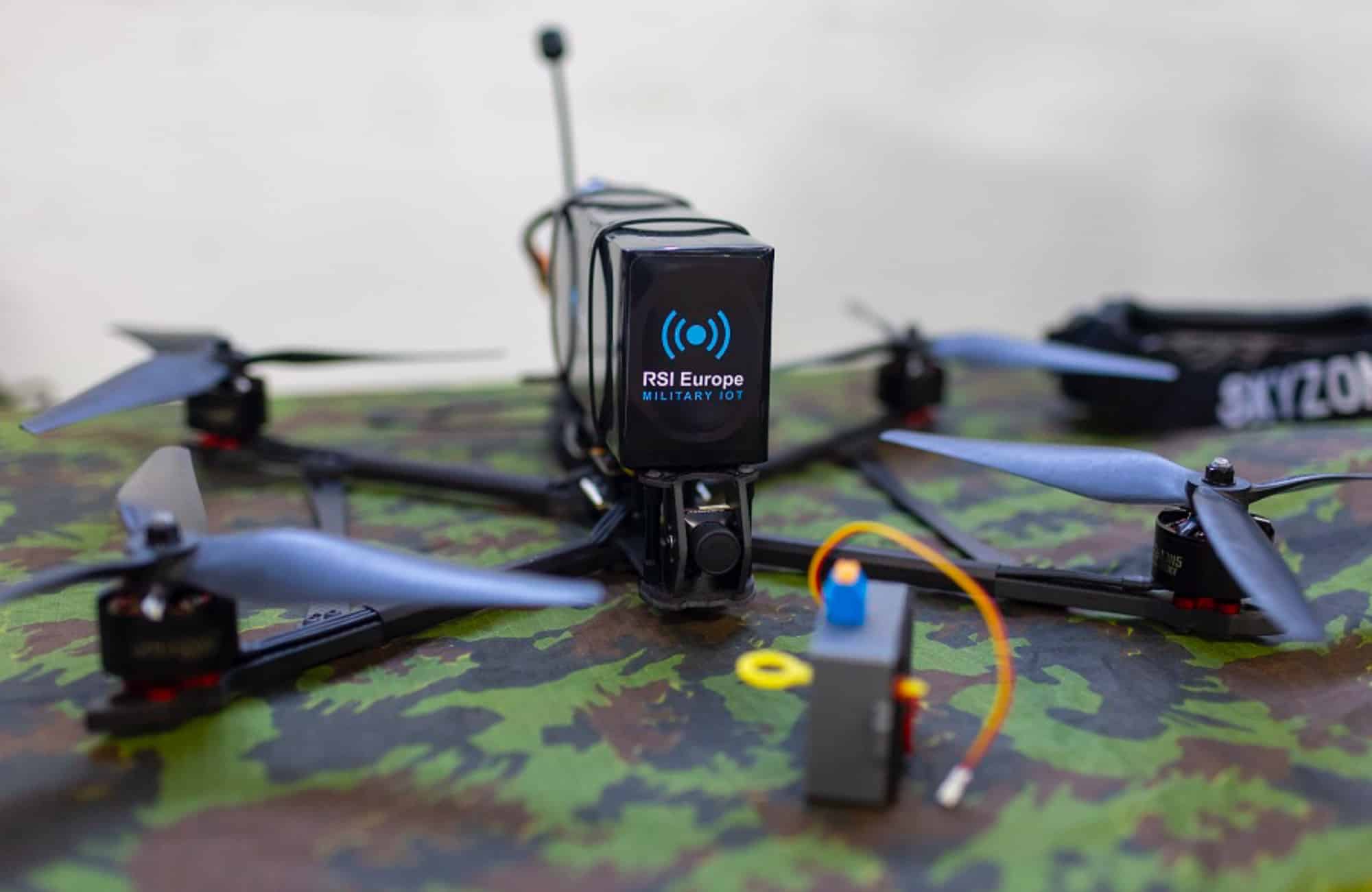 Side view of the Shpak quadcopter with antenna, camera and battery pack.