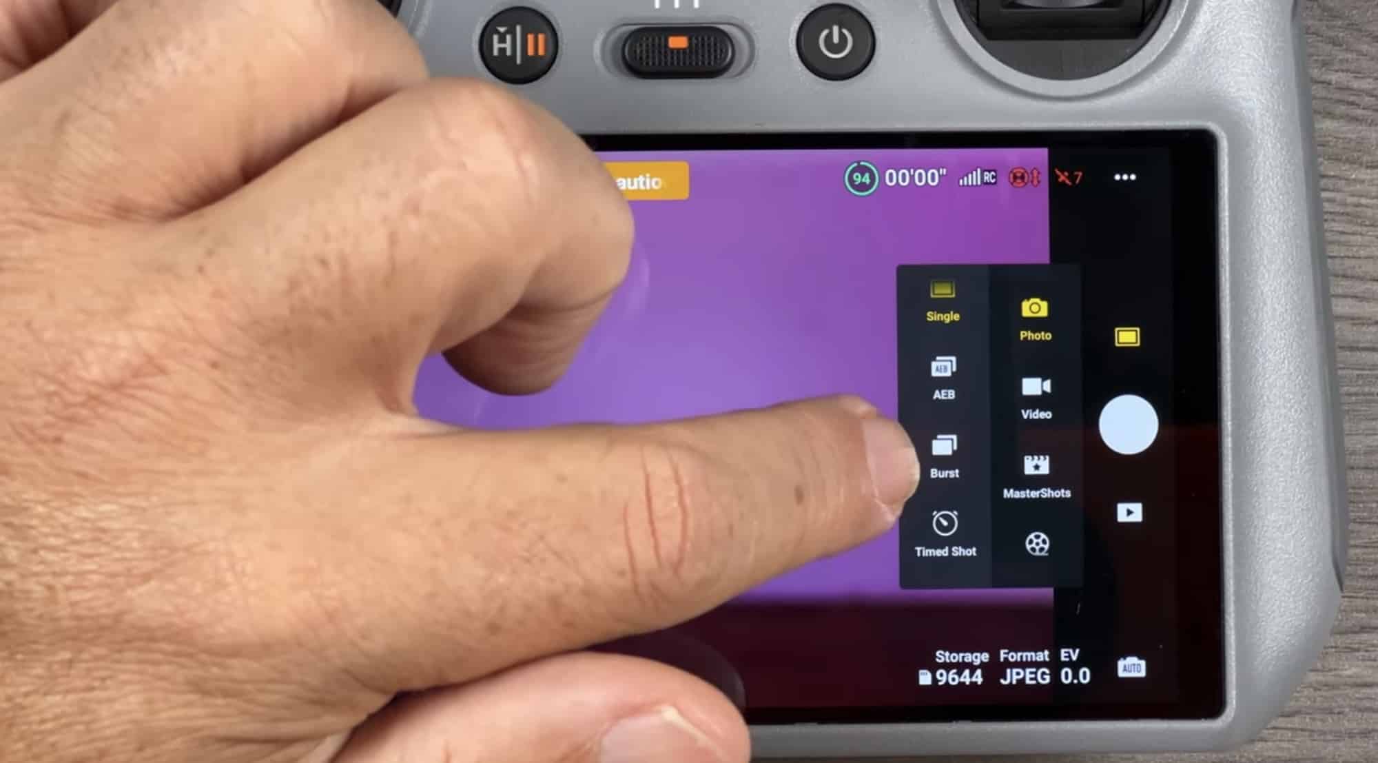 DJI RC2 controller with its built-in screen, mode selector, and gimbal dials.